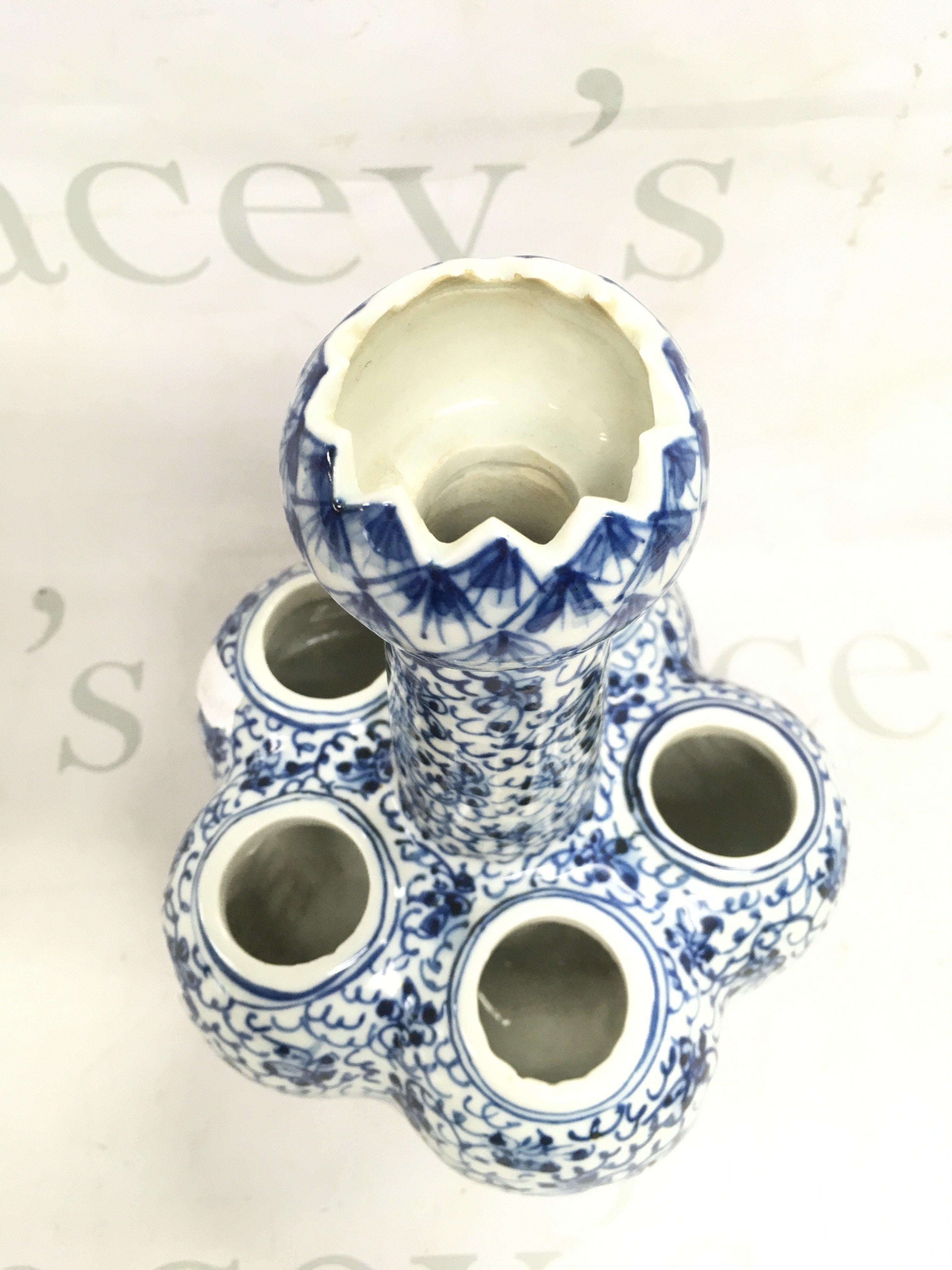 A Chinese blue and white porcelain tulip vase signed on base , 23cm high