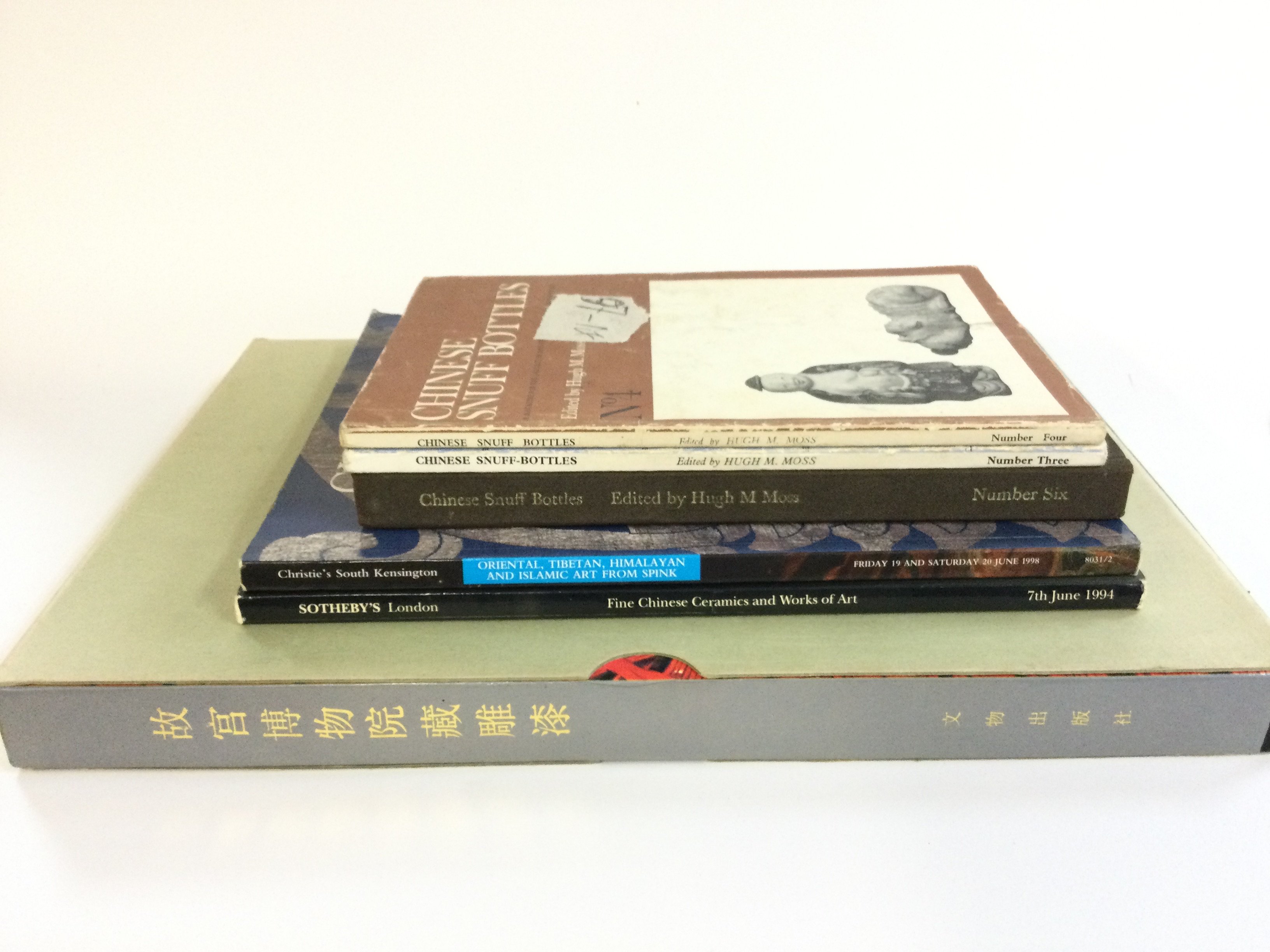 A box with Chinese Snuff Bottles books, Sotherbys and Christies catalogues . Postage category B