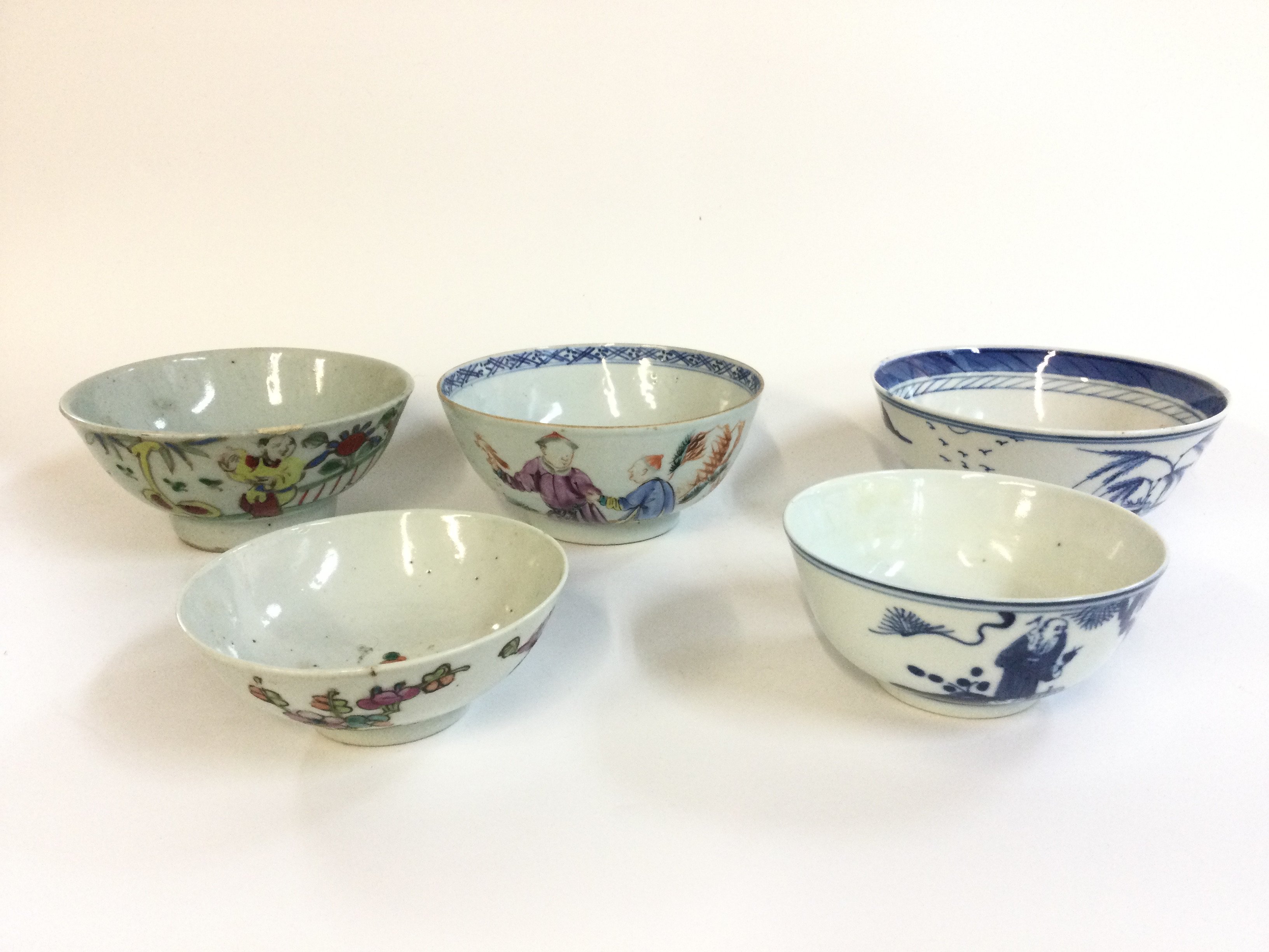 Five Chinese bowls including blue and white and Famille rose examples . Approximately 4-5&#2013266057۝ wide.