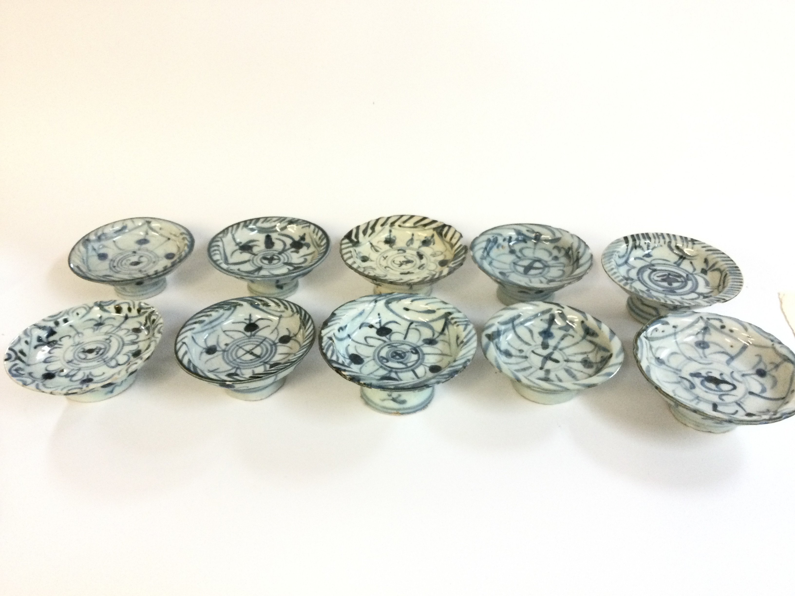 Ten Chinese Ming style stem bowls . Approximately 5cm tall , 10-12cm wide.