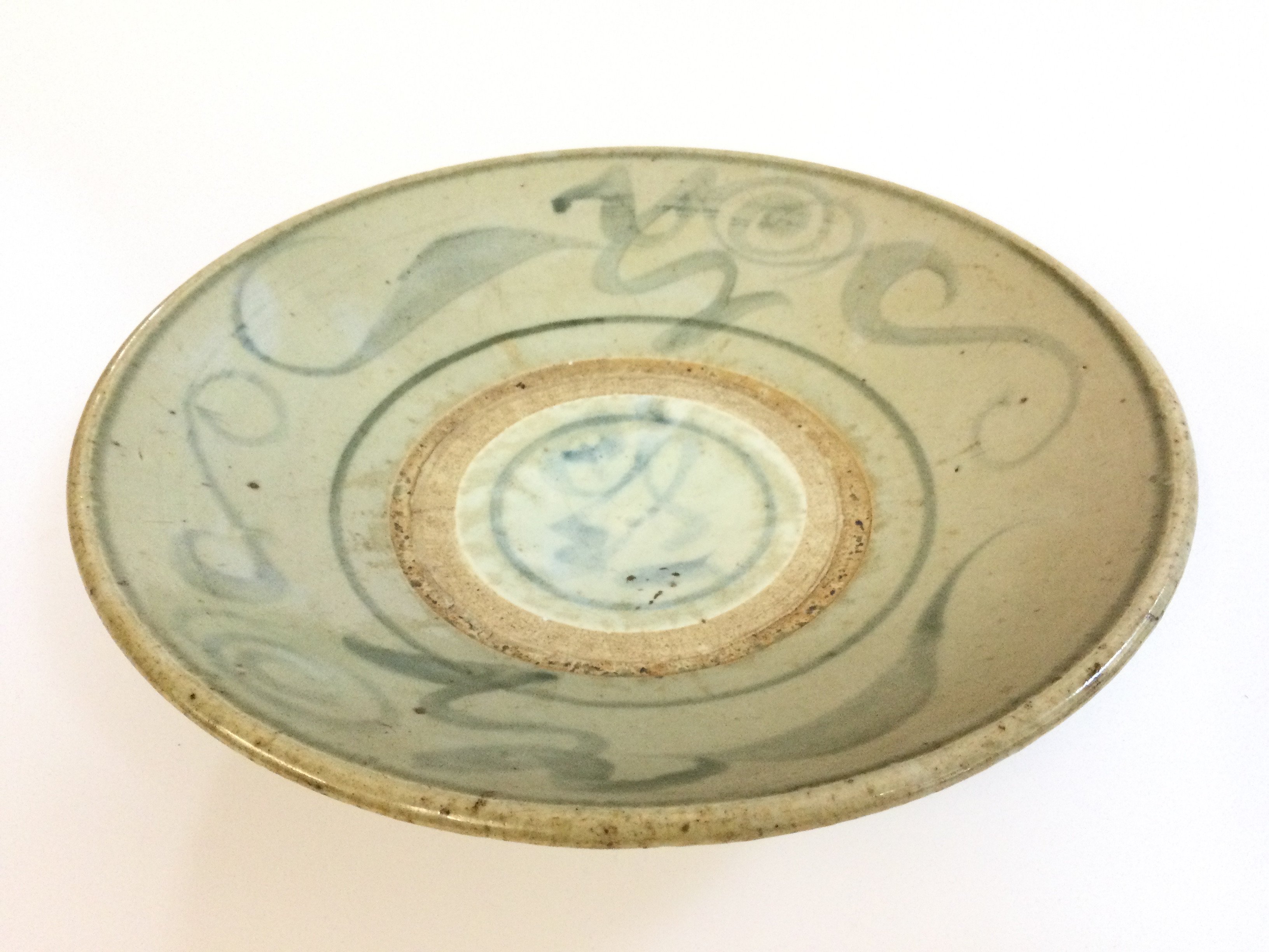 A large Chinese blue and white ming porcelain charger, approximately 27cm wide.