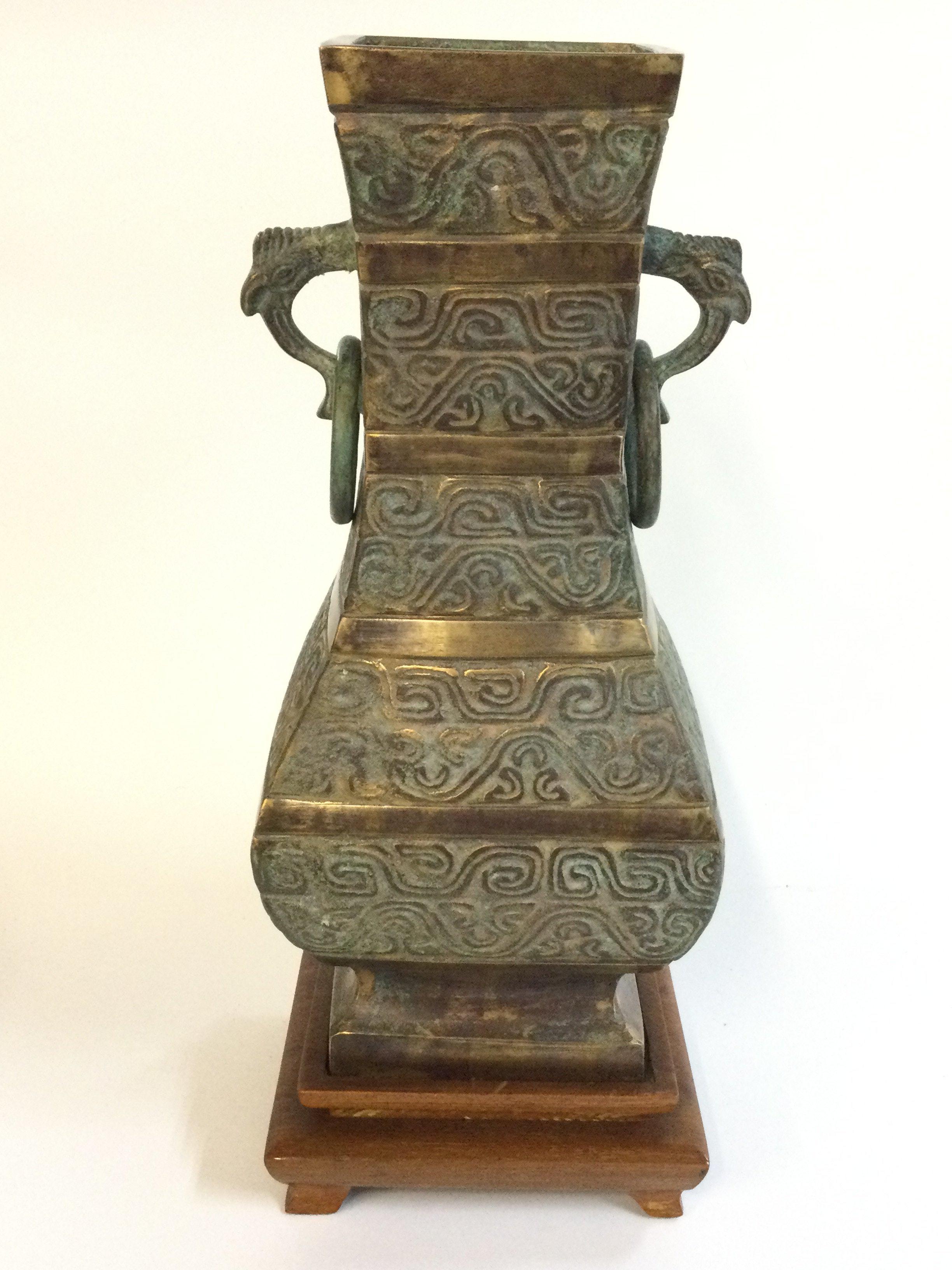 A large Chinese bronze Archaic form vase with stand , 34cm tall. Postage category C