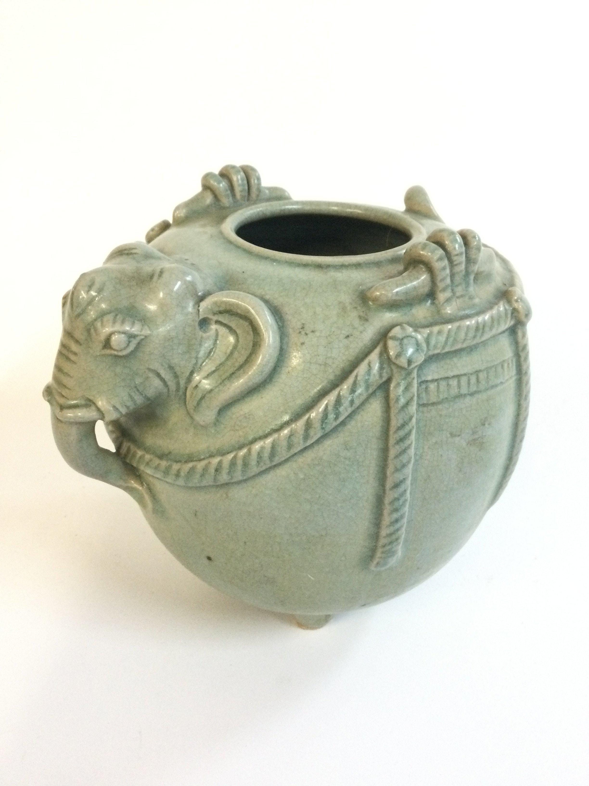 A Chinese celadon elephant shaped vase censer , approximately 16Cm tall.