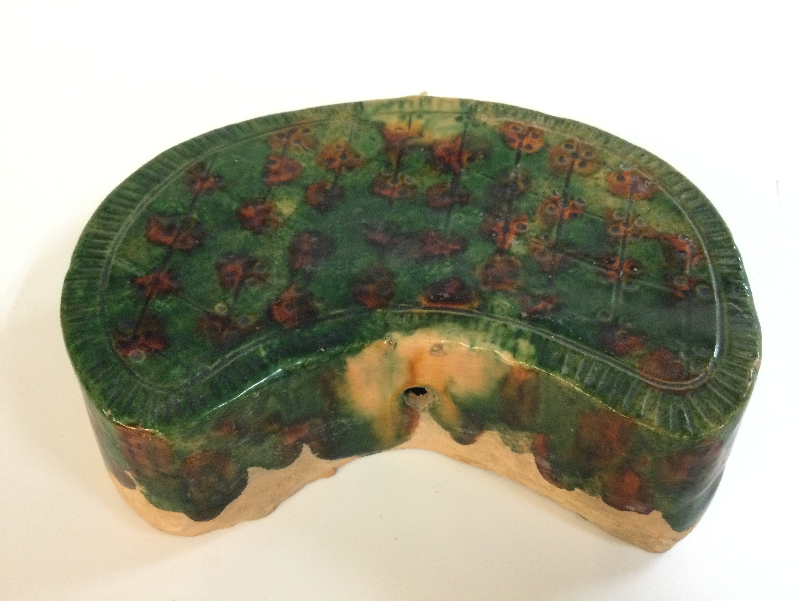 Chinese Samcai glazed terracotta pillow, Tang Dynasty style . 20cm wide, 6cm tall.