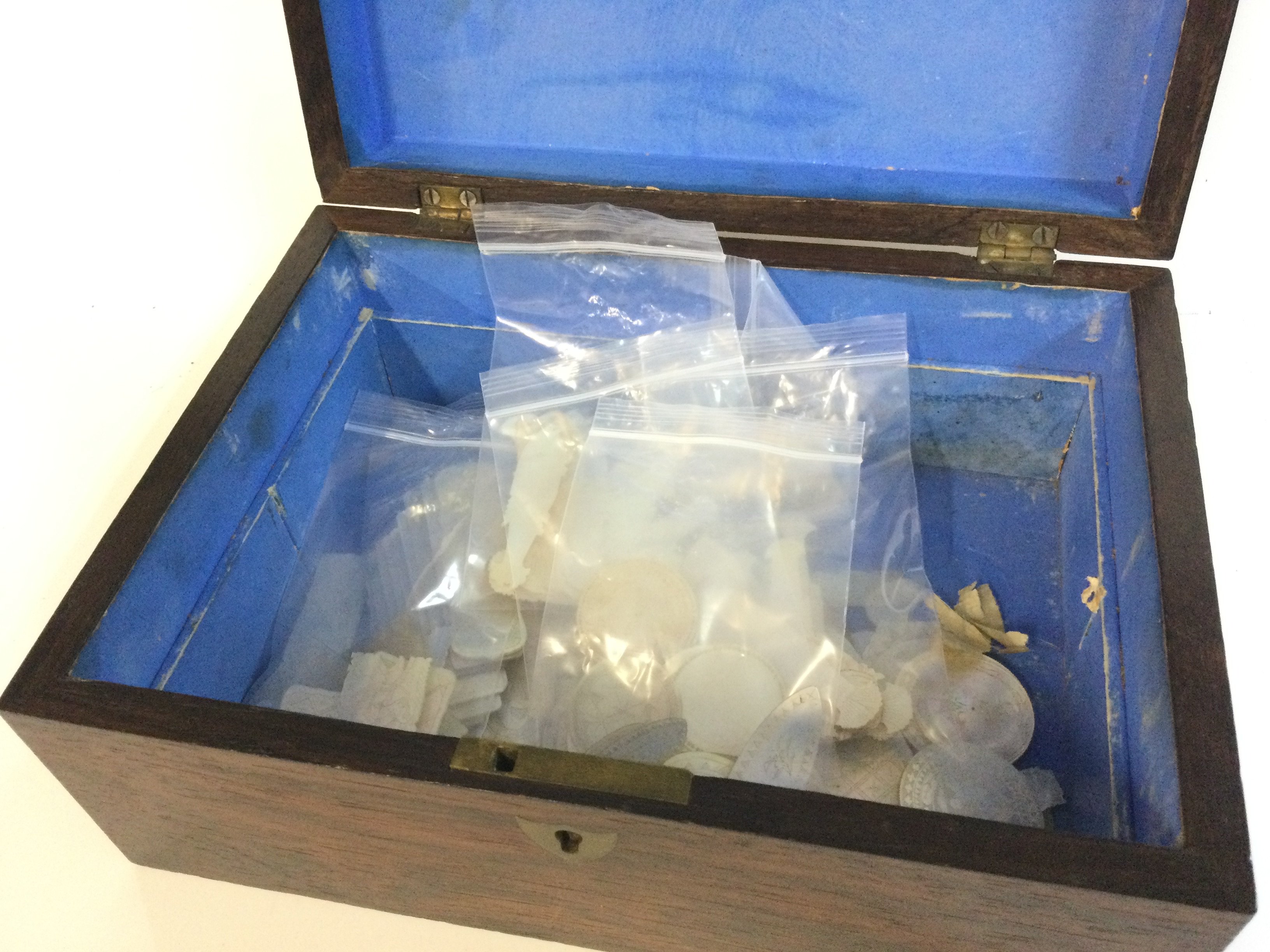 Approximately 90 Chinese mother of pearl gaming counters in an antique box . Postage category B