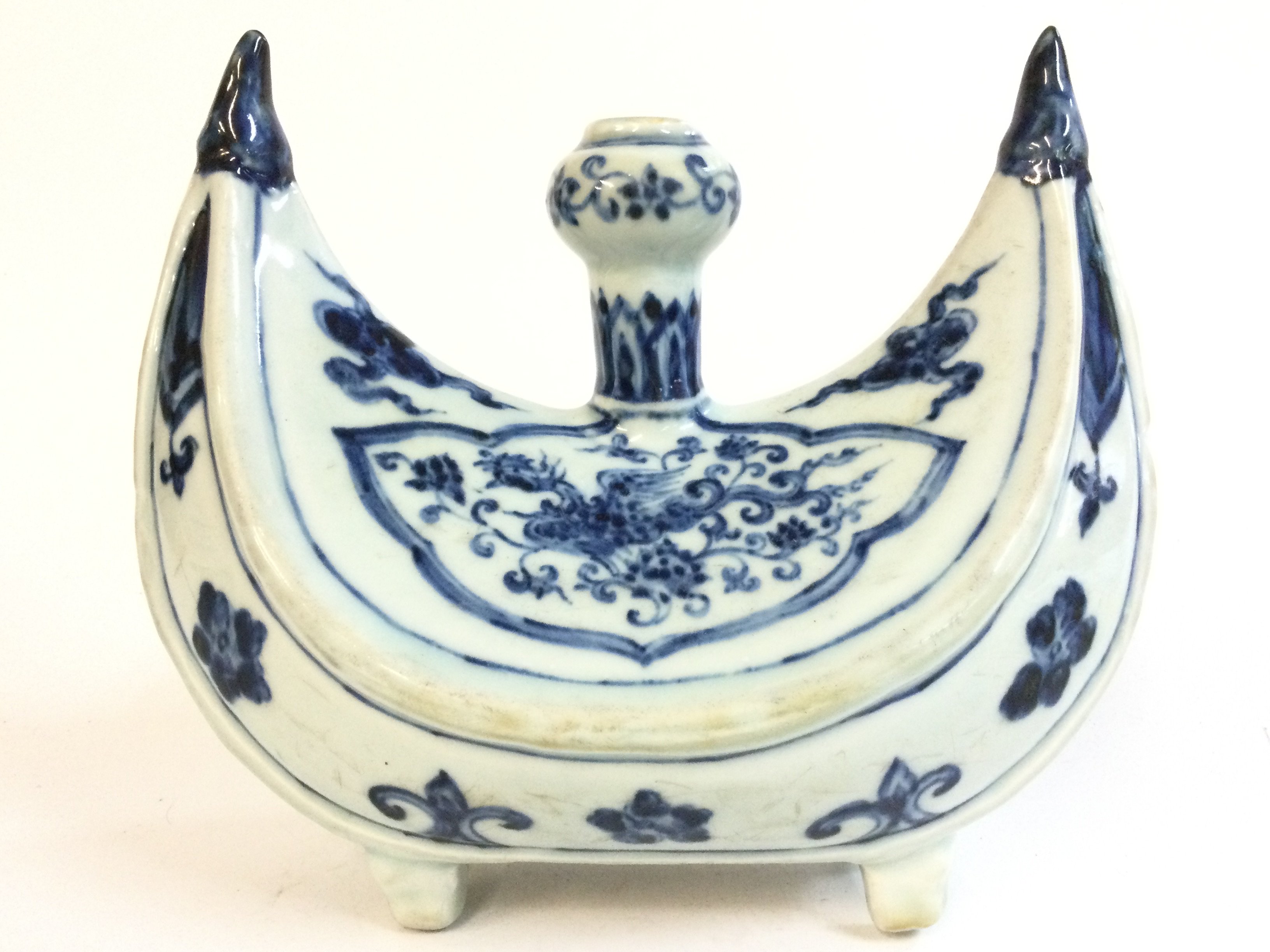 A Chinese Islamic blue and white porcelain four footed candle holder , hand painted with flowers 20cm wide, 18cm tall.