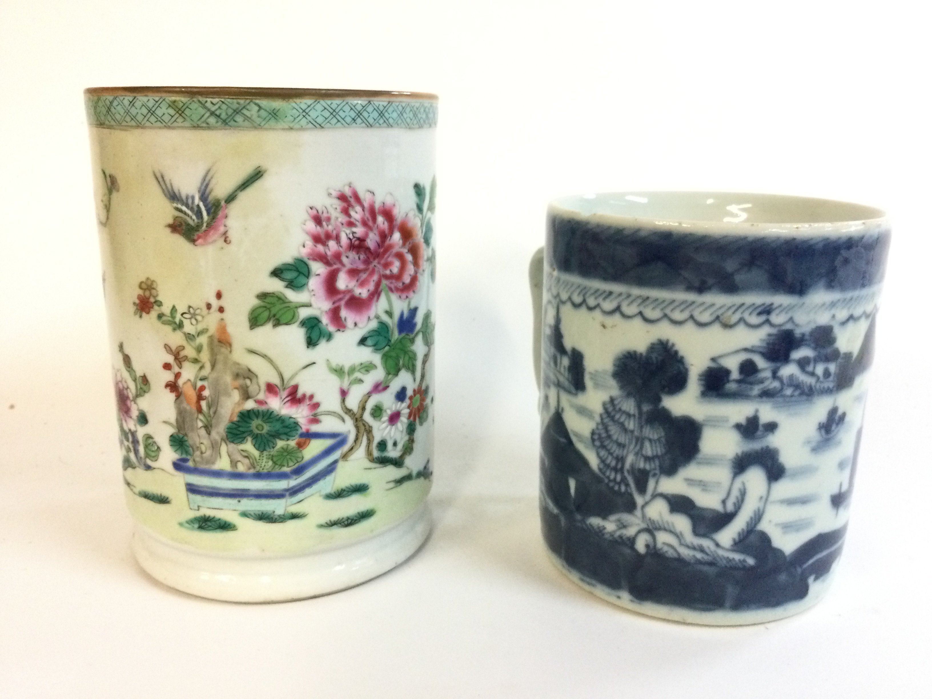 Two Chinese porcelain tankard mugs, 14 and 11cm tall.