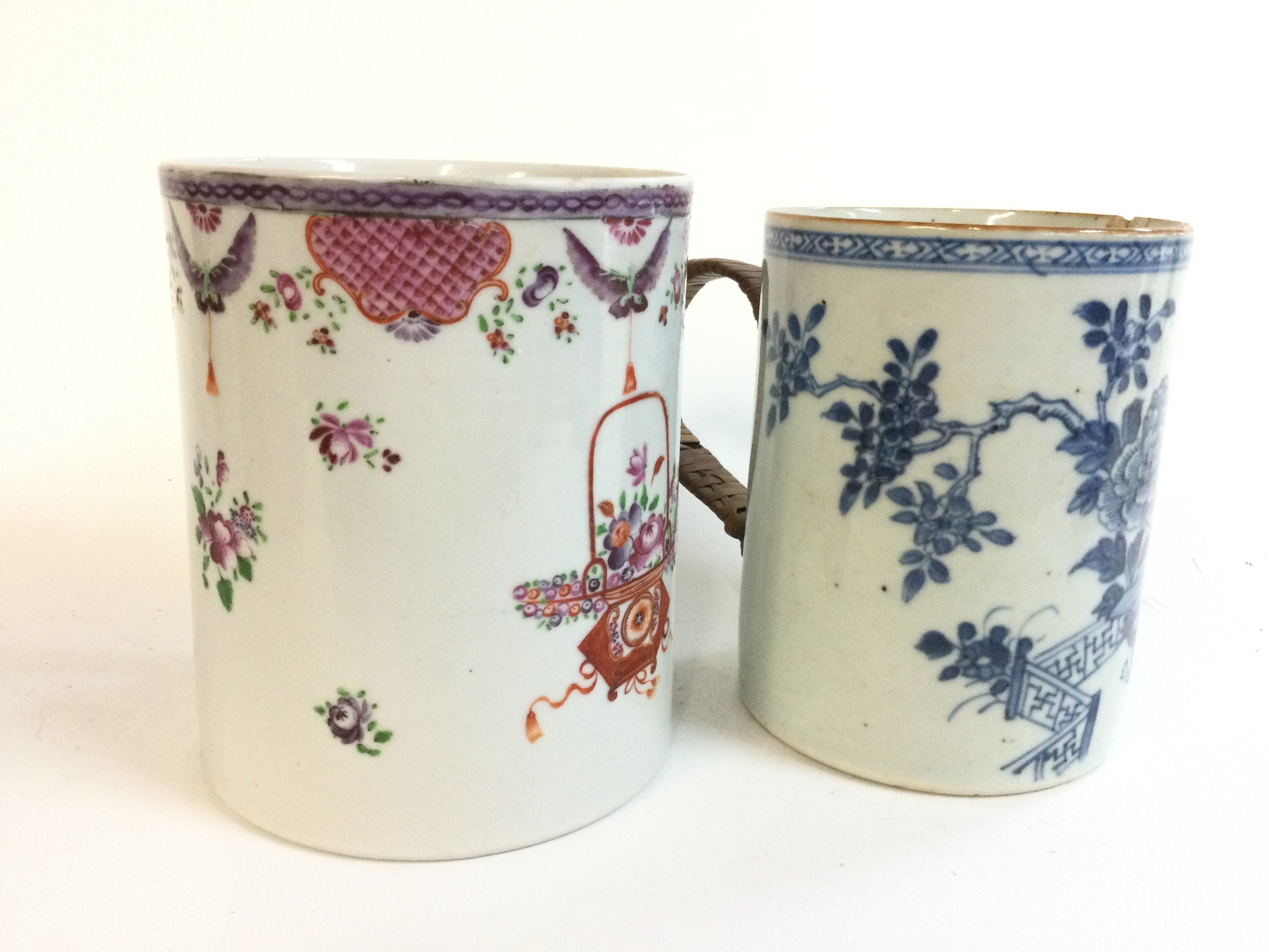 Two Chinese tankards Famille rose and blue and white designs. 12 and 13cm tall.