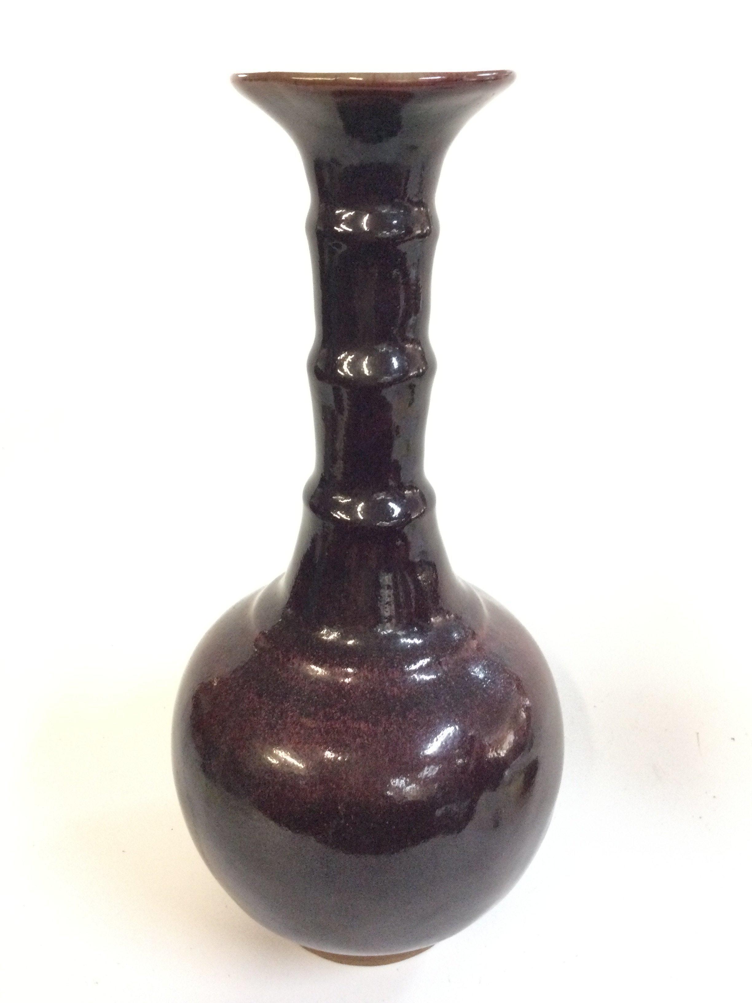 A Chinese Sang De Boeuf stoneware vase , 34cm tall.