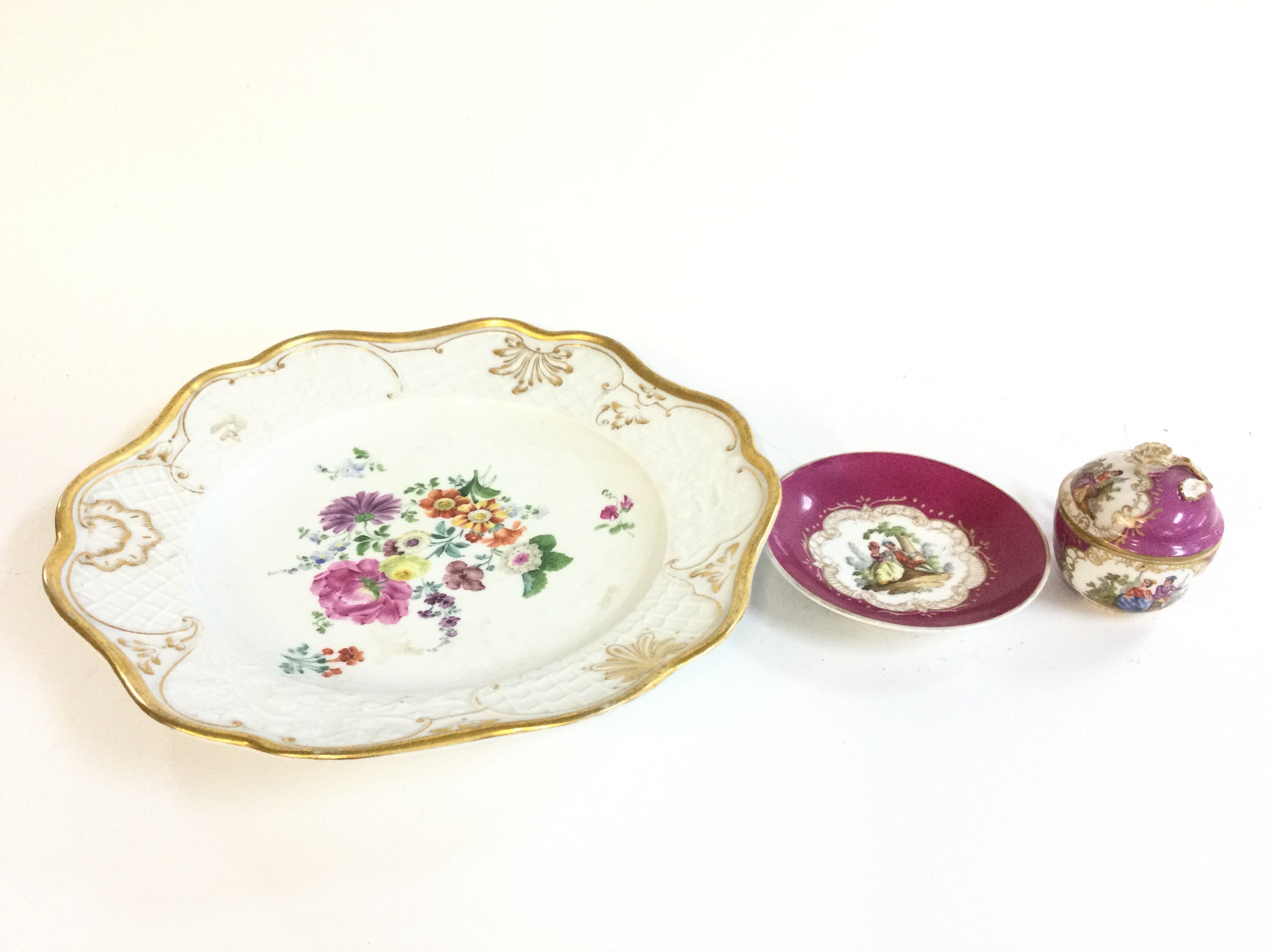 Meissen style plate (27cm wide) and a cup (7cm tall) and saucer (11cm wide) .