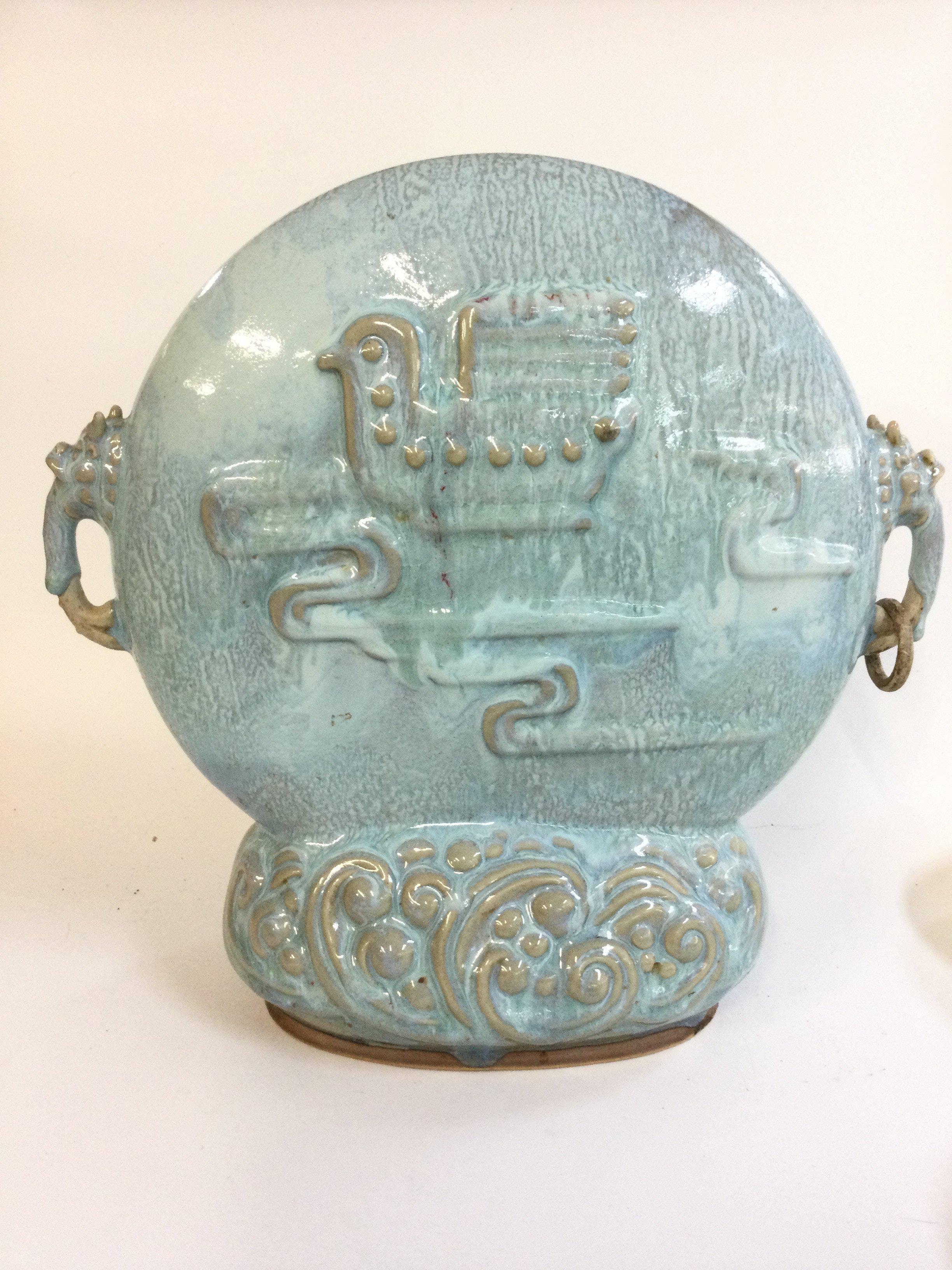 A Chinese porcelain centrepiece vase , decorated in relief with birds . 33cm tall 34cm wide approximately