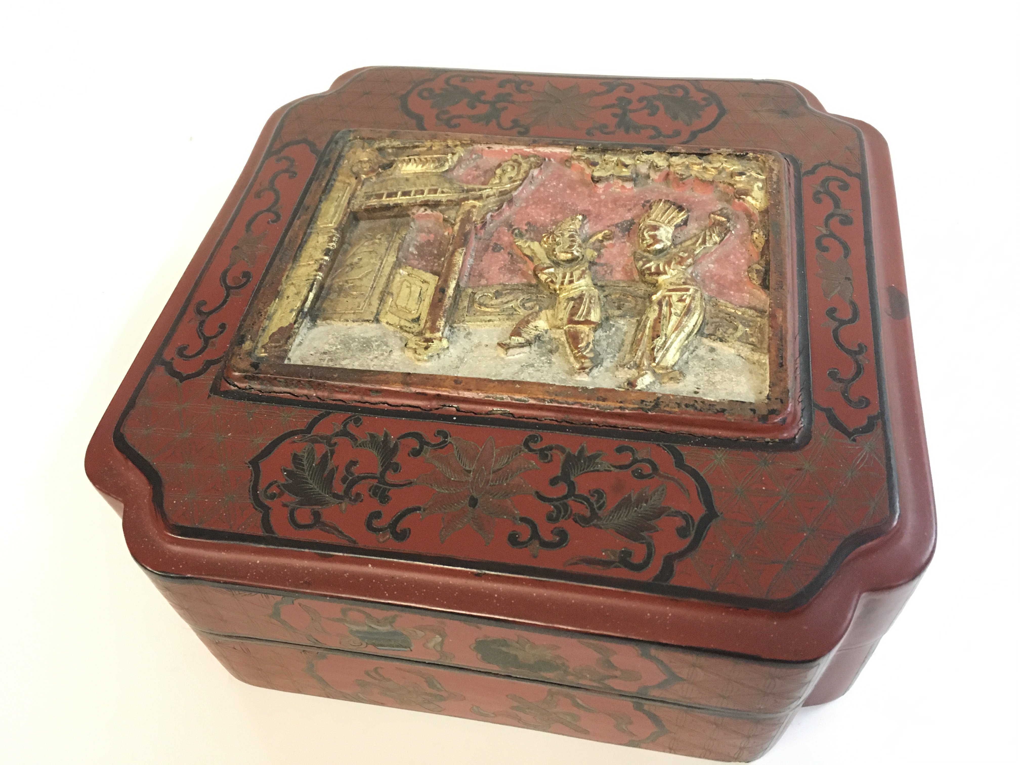 A large Chinese red cinnabar box. 9cm tall 24cm wide . Postage catC