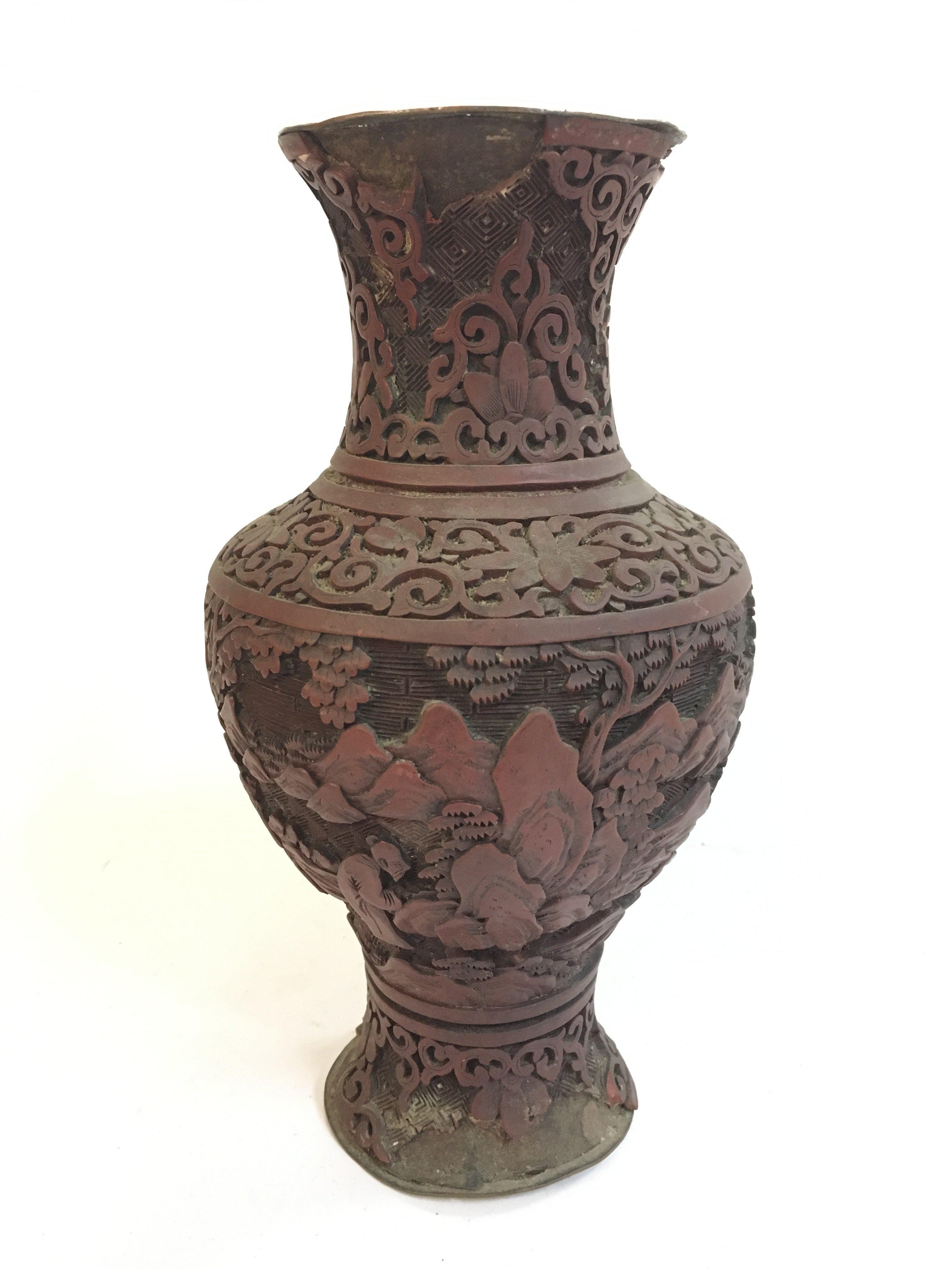 A Chinese red cinnabar vase, 23cm wide. Postage category B