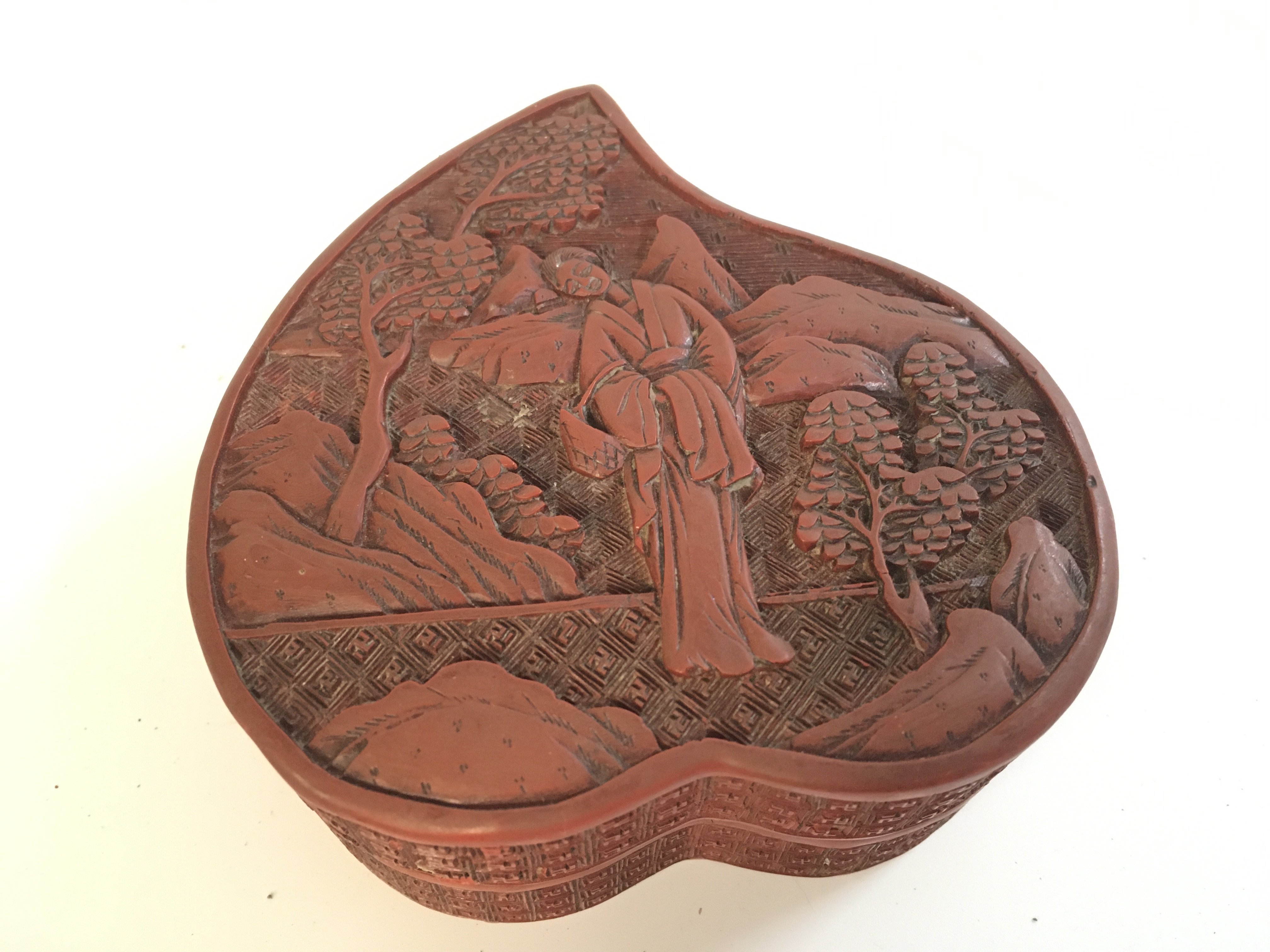 A Chinese red cinnabar box , 10cm wide , 5cm tall. Postage category A