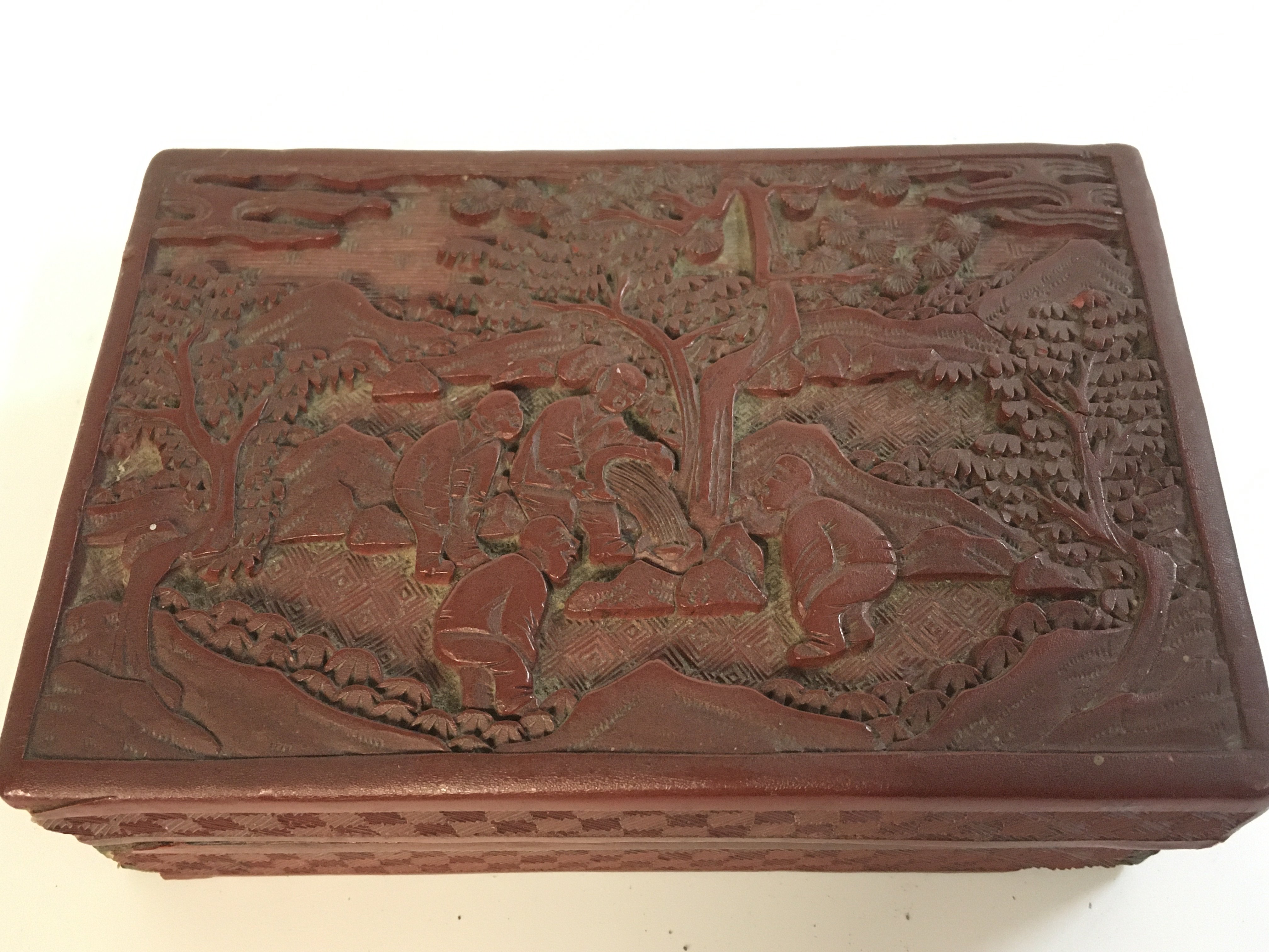 A Chinese red cinnabar box 5cm tall, 14.5cm wide . Postage catA