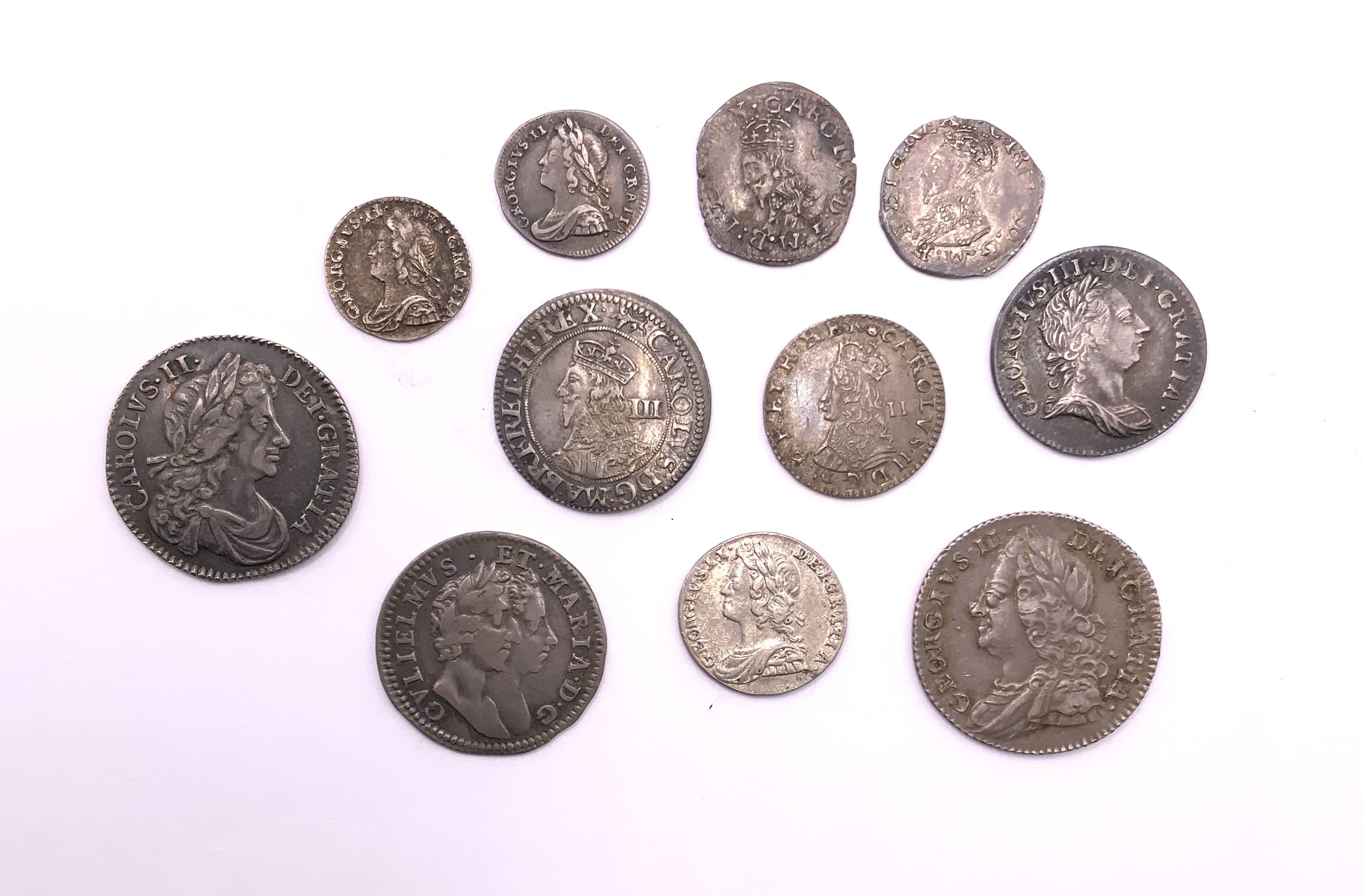 Great Britain. Early milled coin group. 1674 Charles II sixpence GVF, George II sixpence VG, Maundy 4p William & Mary 1689 GVLEELMVS VGF, Maundy 3p George III 1762, Charles I (1625-1649) Silver Threepence York Mint GVF, Charles II (1660-1685)Silver Maundy Twopence, George II Maundy Two pence 1735, 2 George II (1739/1760) Maundy 1 Pennys. (2 Charles 1st coins).