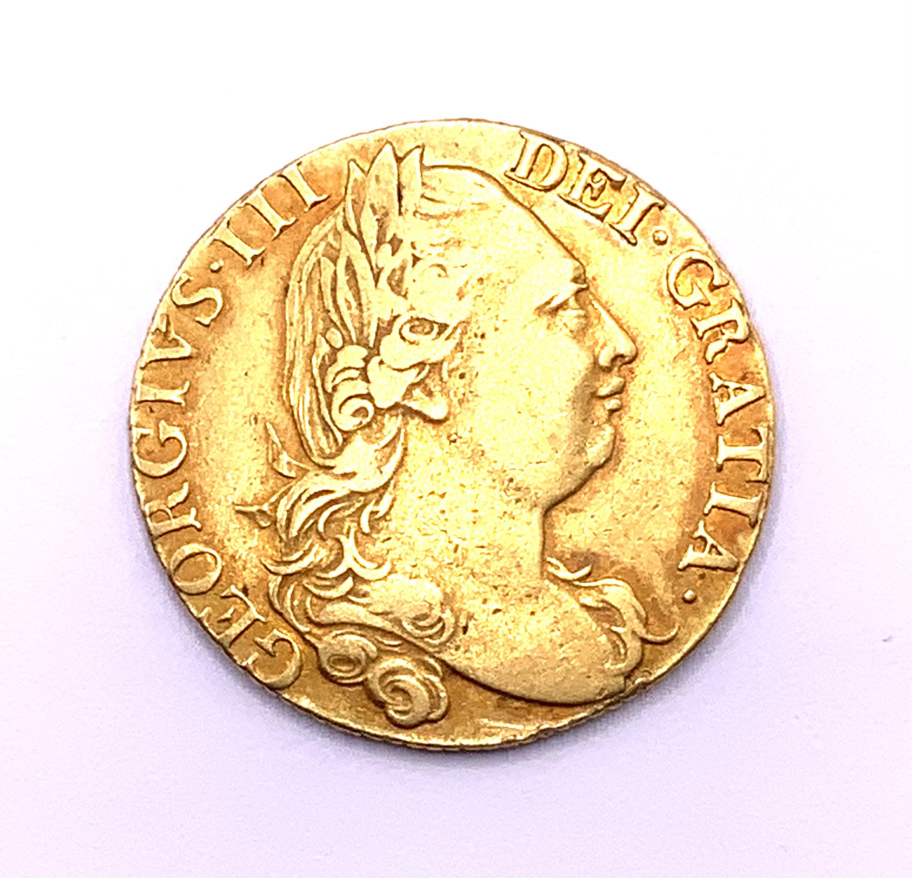 Great Britain, George III Guinea 1777 "Fourth laureate bust" 8.29g. VGF