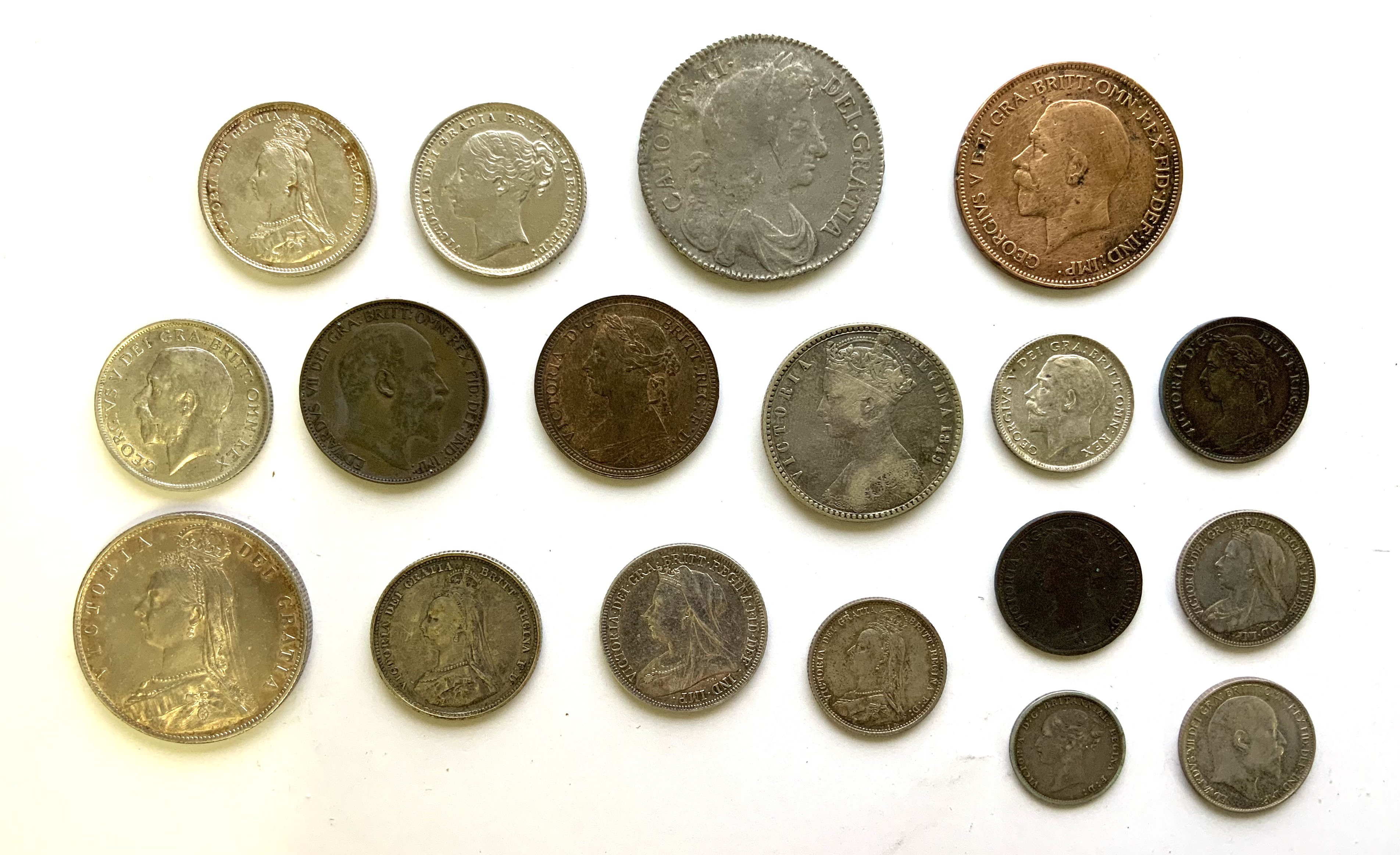 A mixed collection of British and world coinage, to include Charles II 1677 half crown.