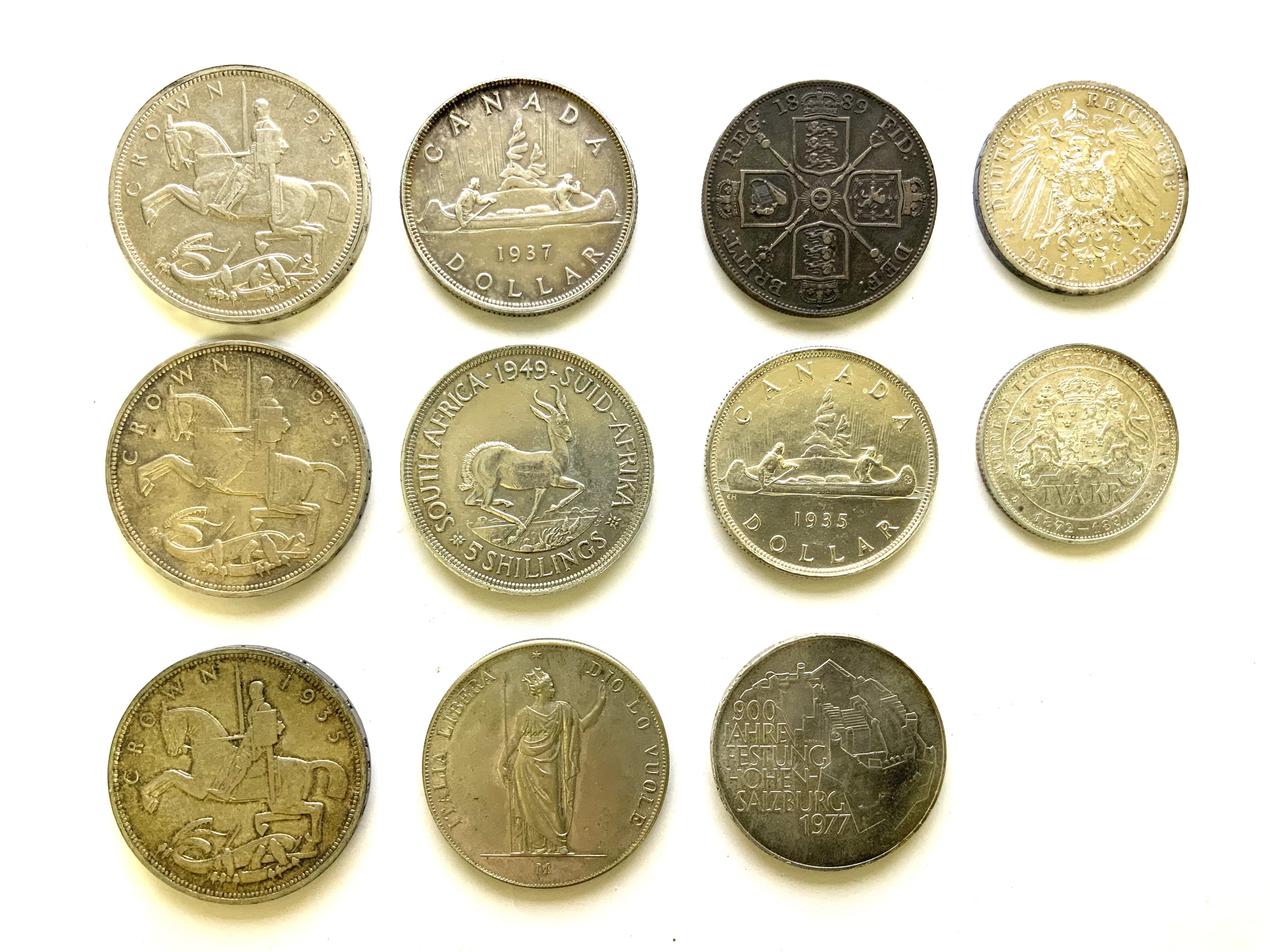 A Collection of British, Commonwealth and world silver coins to include 3 1935 crown edge inscription Regina XXV, 1889 Crown,1935 and 1937 Canada Dollar, 1949 South African 5 Shillings, 1913 Prussia Germany 3 Mark Silver coin, Swedish 1897 2 Kronor silver jubilee coin, 1977 Austrian 100 Schilling silver coin, 1848 Italian states 5 Lire silver coin.