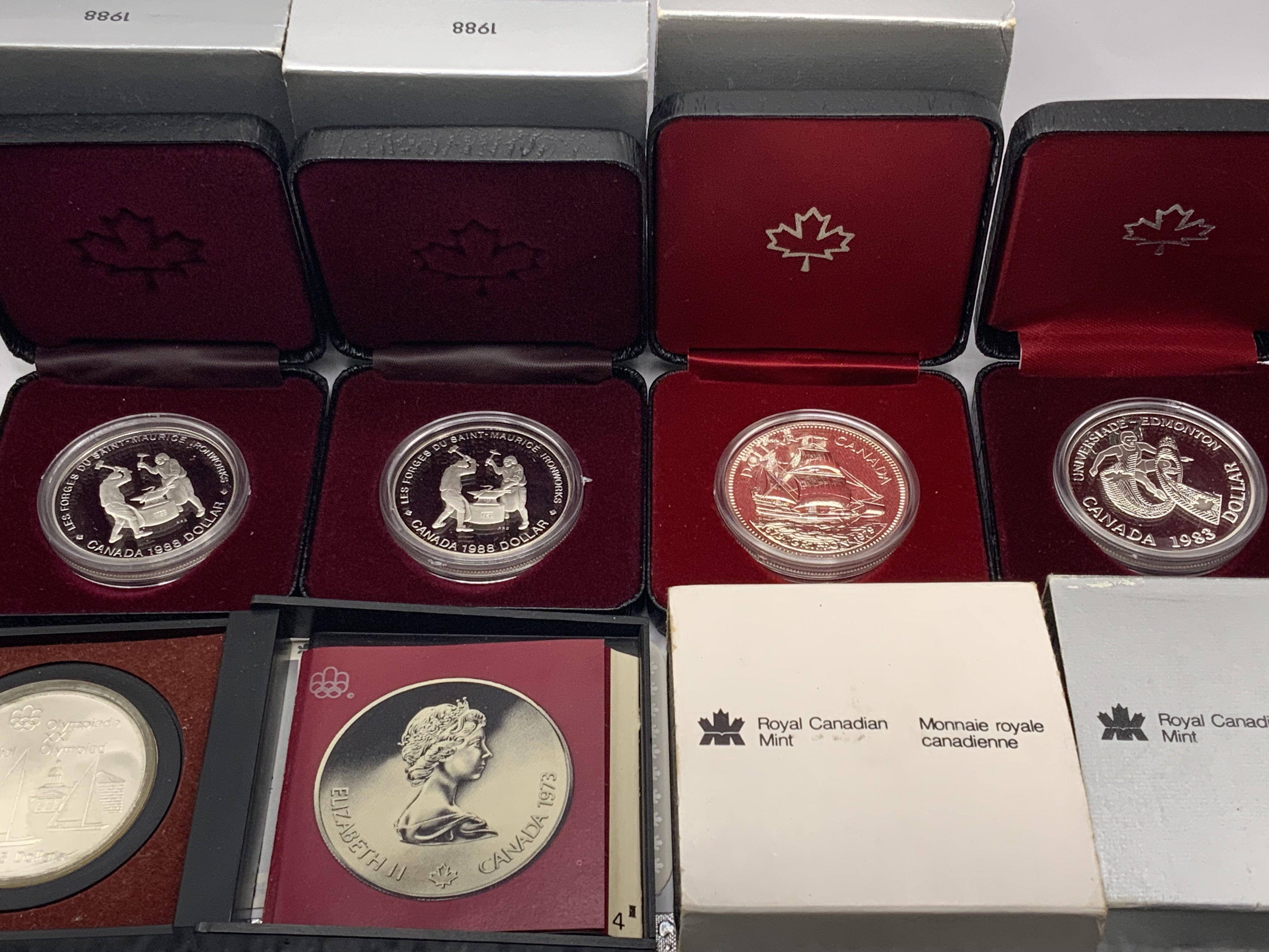 Royal Canadian Mint, 7 Silver commemorative cased coins.