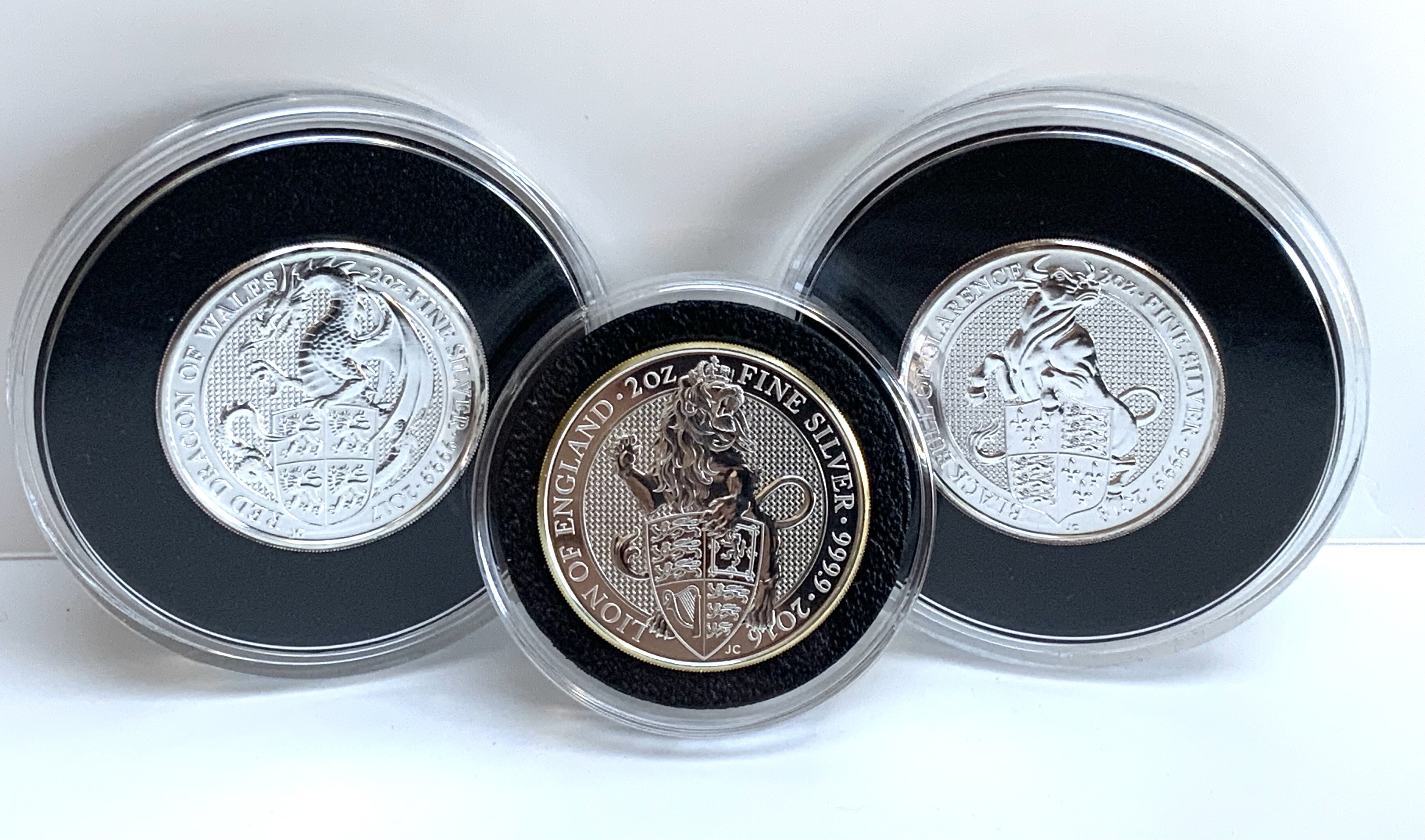 Queens Beasts Fine silver 2 ounce coins. 2016 Lion Of England, 2017 Red Dragon of Wales, 2018 Black bull of Clarence. (3)