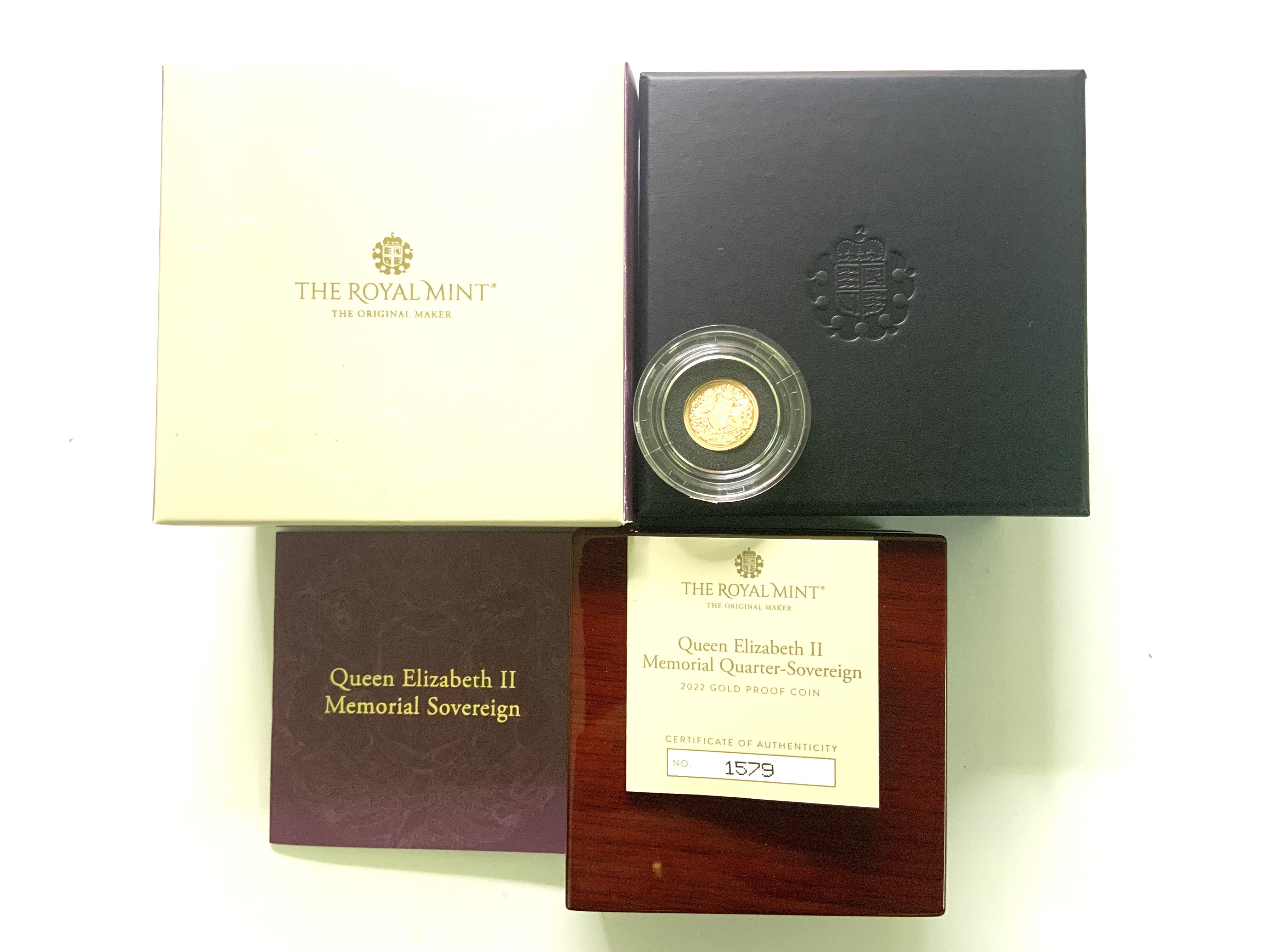 A Queen Elizabeth II Memorial proof quarter sovereign. (A)