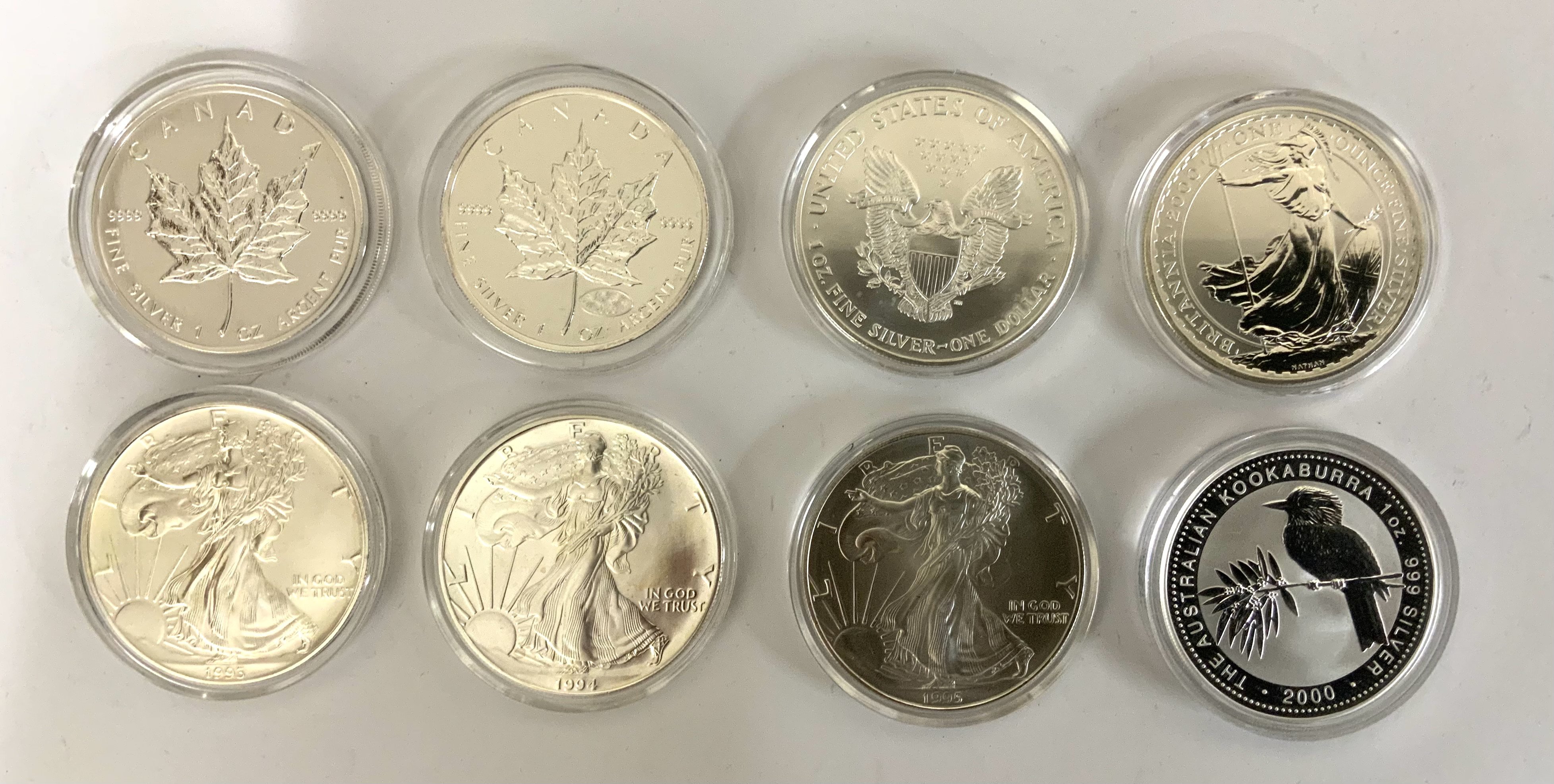 8 1 ounce silver proof coins. 2000/2001 Canada maple leaf, 93,94,95, 2000 Liberty Dollars, 2000 Brittania, 2000 Kookaburra.