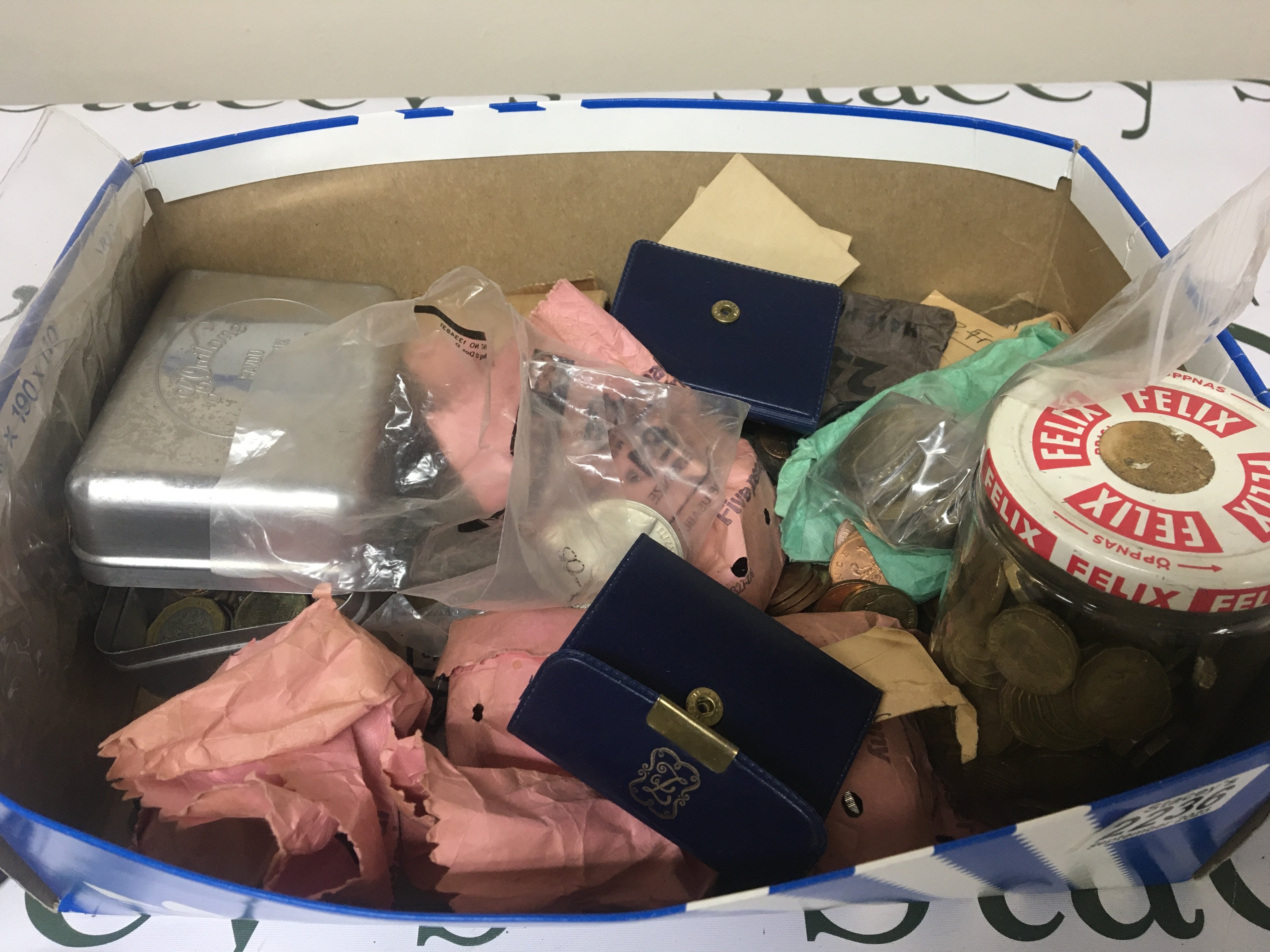 A box containing a collection of British pre and post decimal coinage commemorative crowns and some Italian 1974 commemorative coinage in presentation packs.