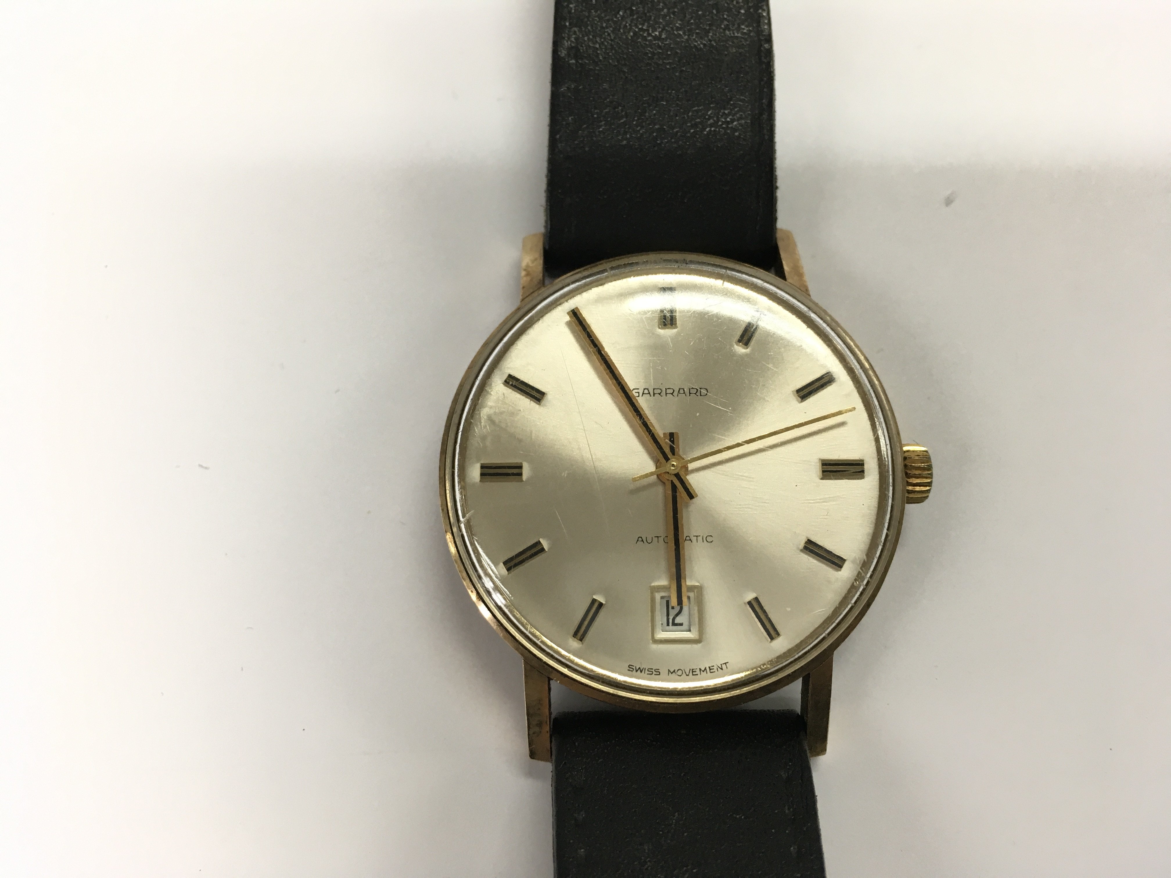 A gold cased gents Garrard wrist watch. 41.16g