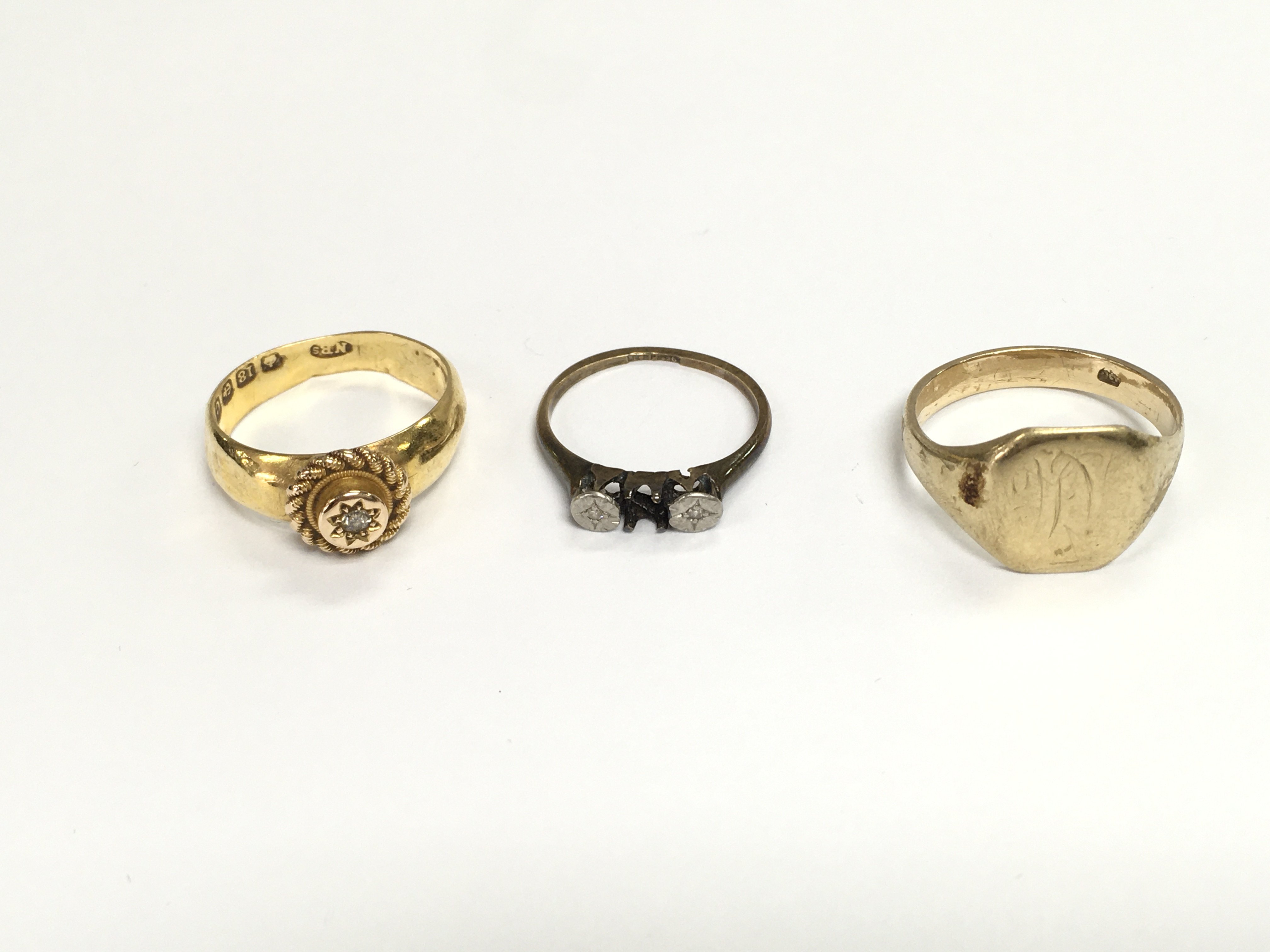 An 18ct gold ring 3.14g and two 9ct gold rings 5.29g