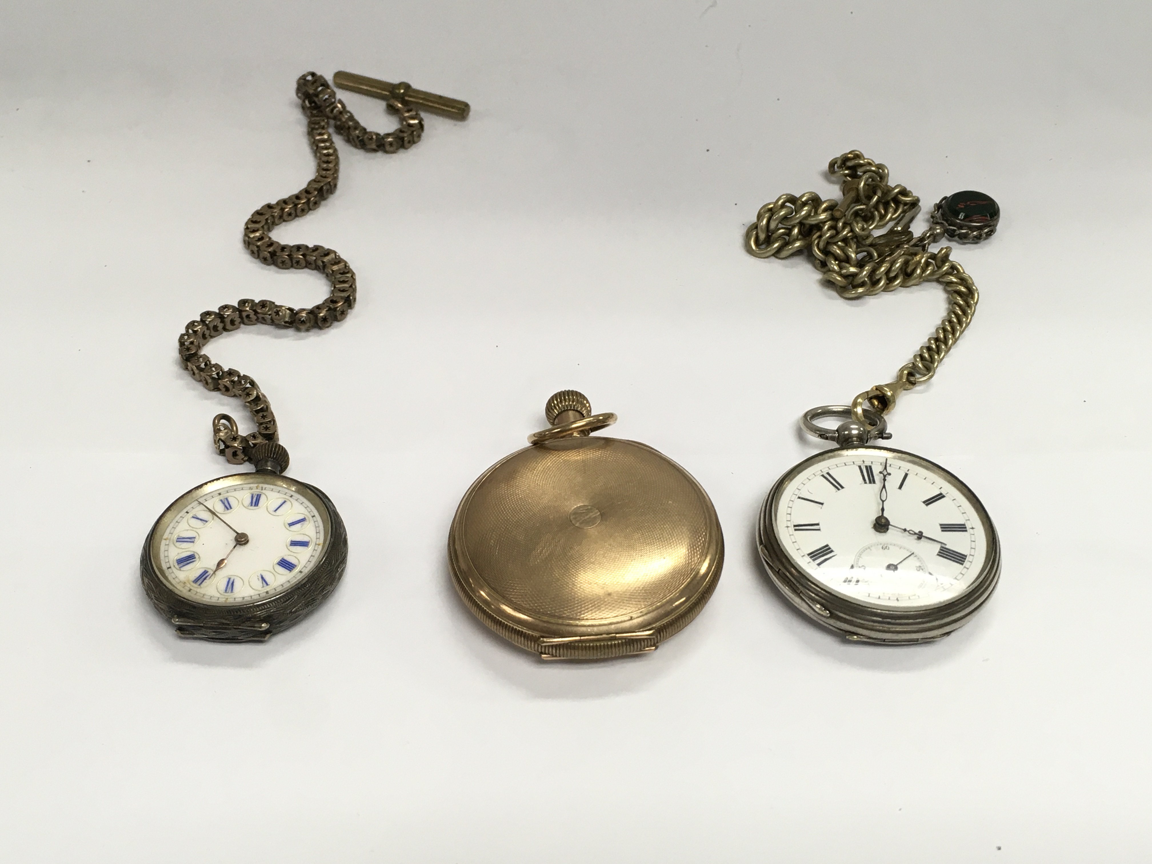 Three pocket watches including a silver cased example.