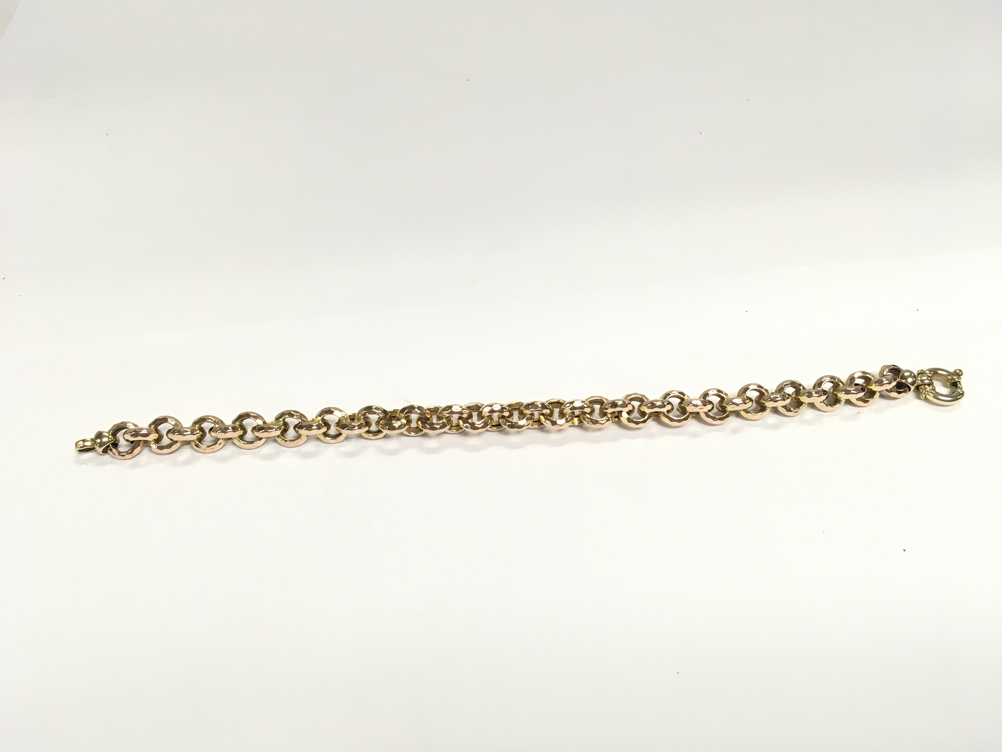 A 9ct gold link bracelet. 21cm long. 13.47g