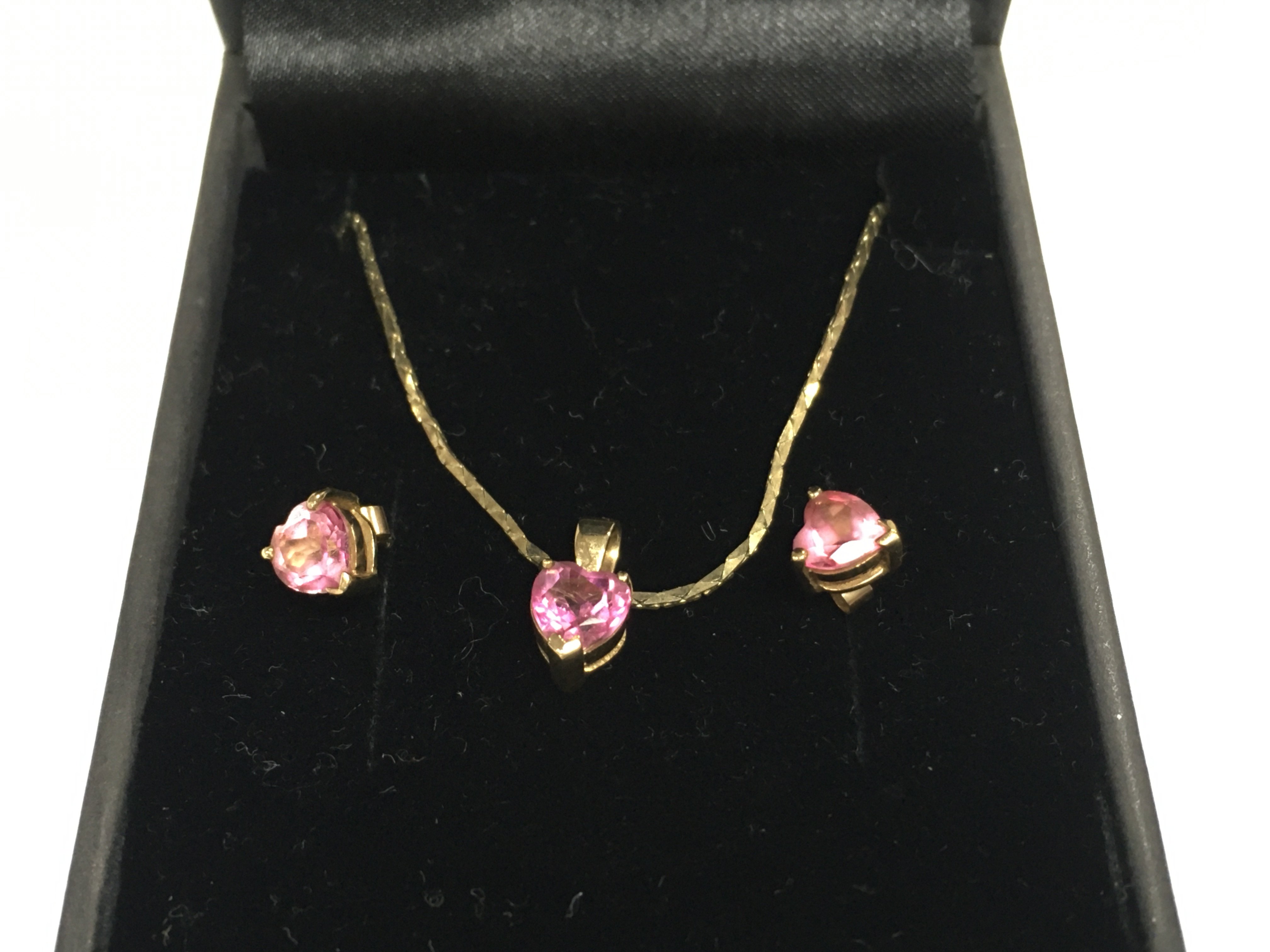 A pair of 9ct gold pink stone earrings and necklace with matching pink stone pendant. Postage B