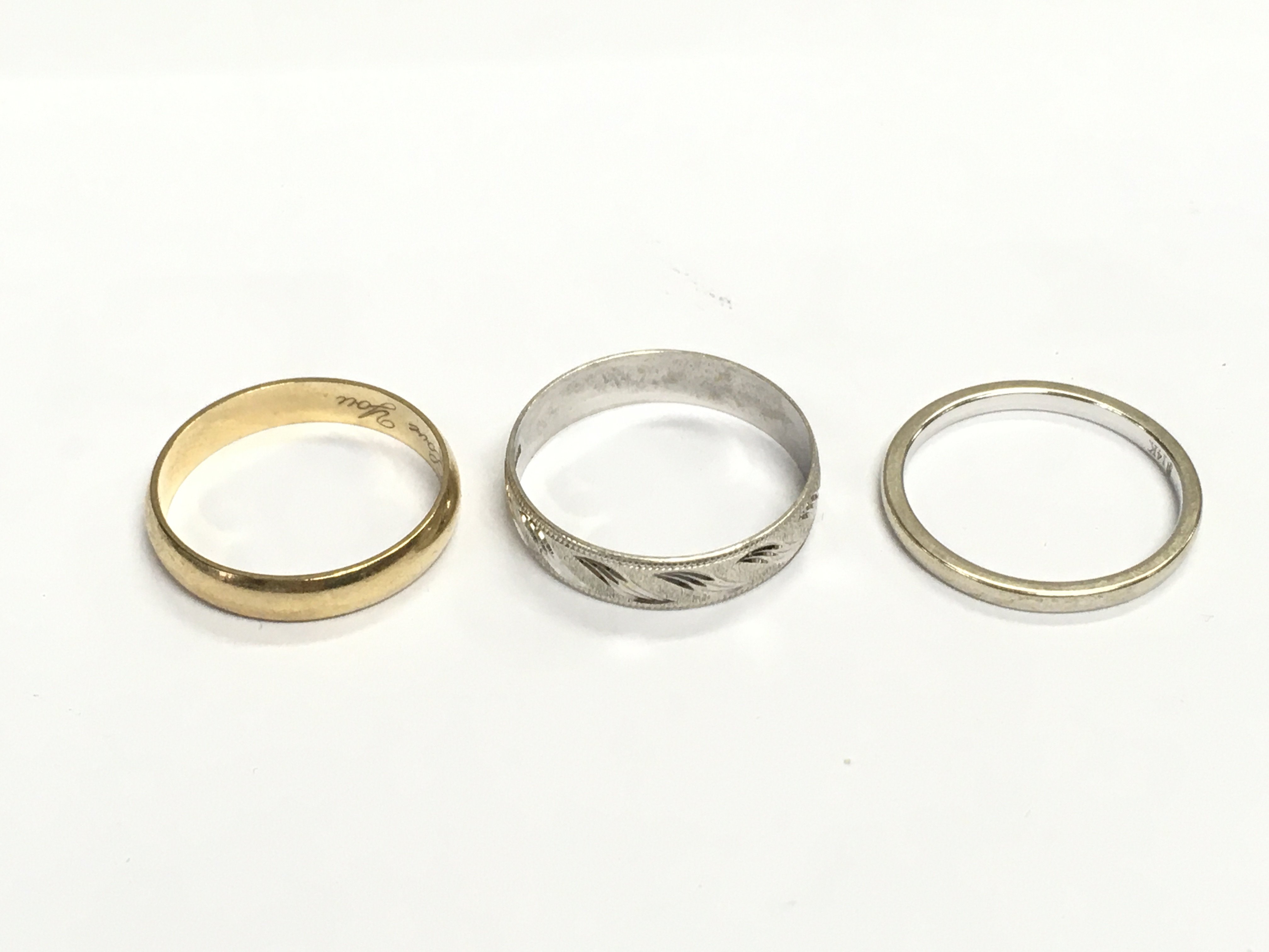 Two 9ct gold rings 4.49g and a 14ct gold ring 2.26g Postage A