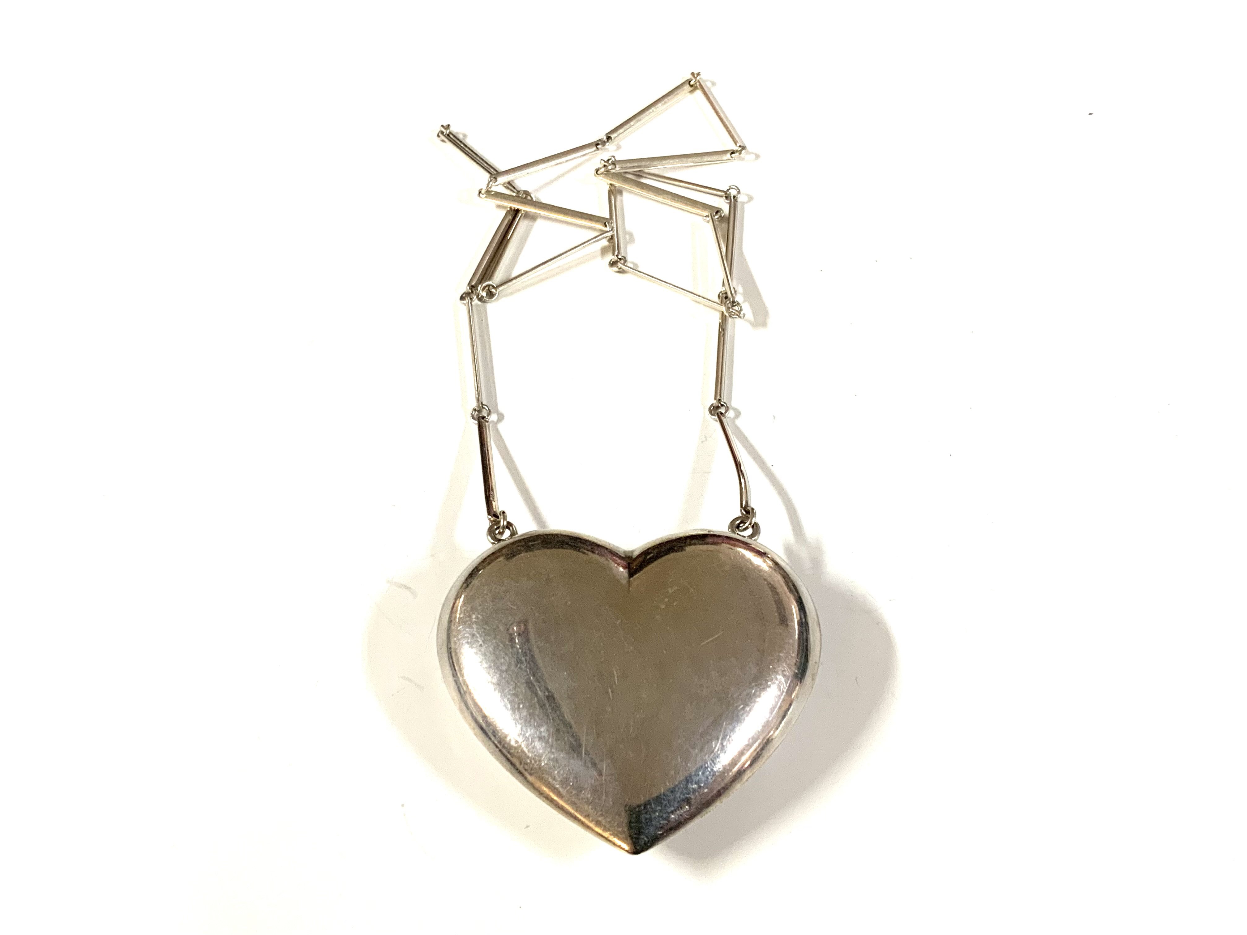 A heavy sterling silver heart pendant /necklace with bar chain.