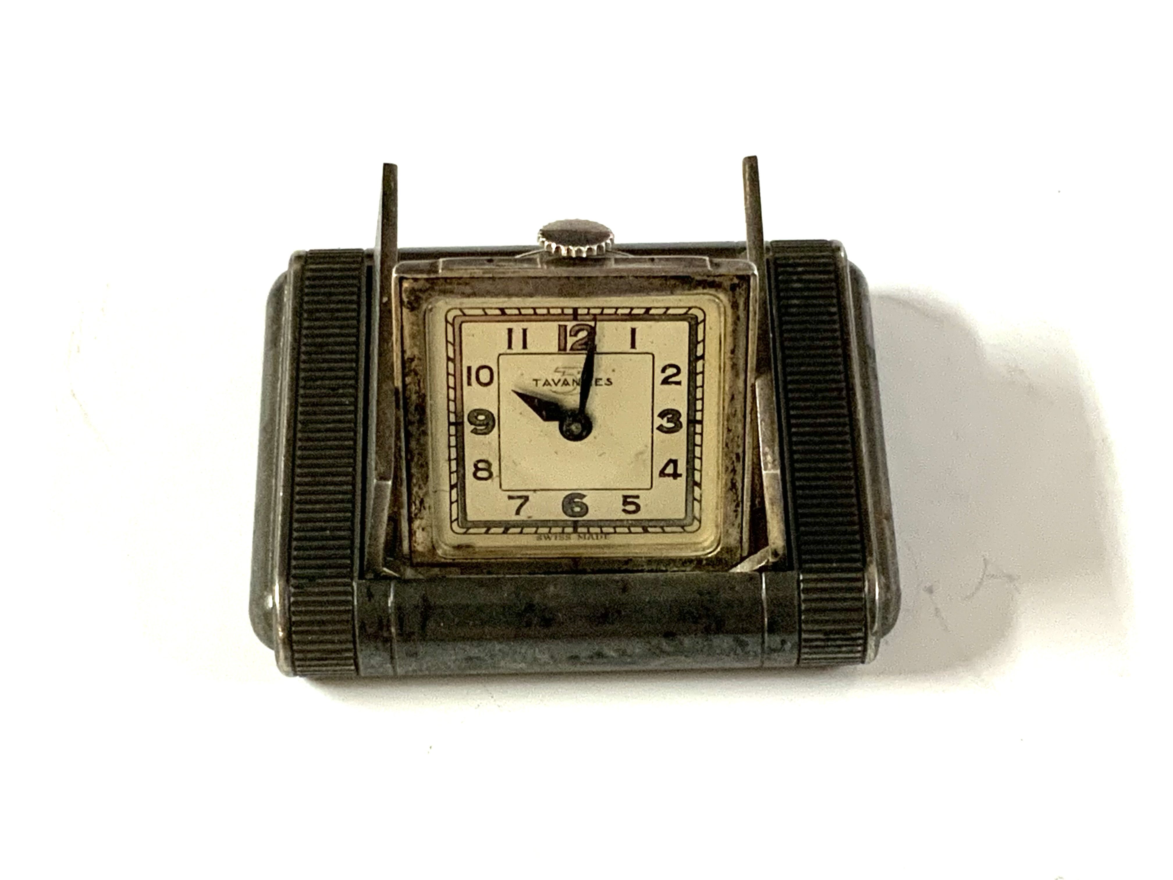 Tavannes silver engine turned purse watch, import hallmarks, with end pushers opening spring loaded doors revealing the square silvered dial.