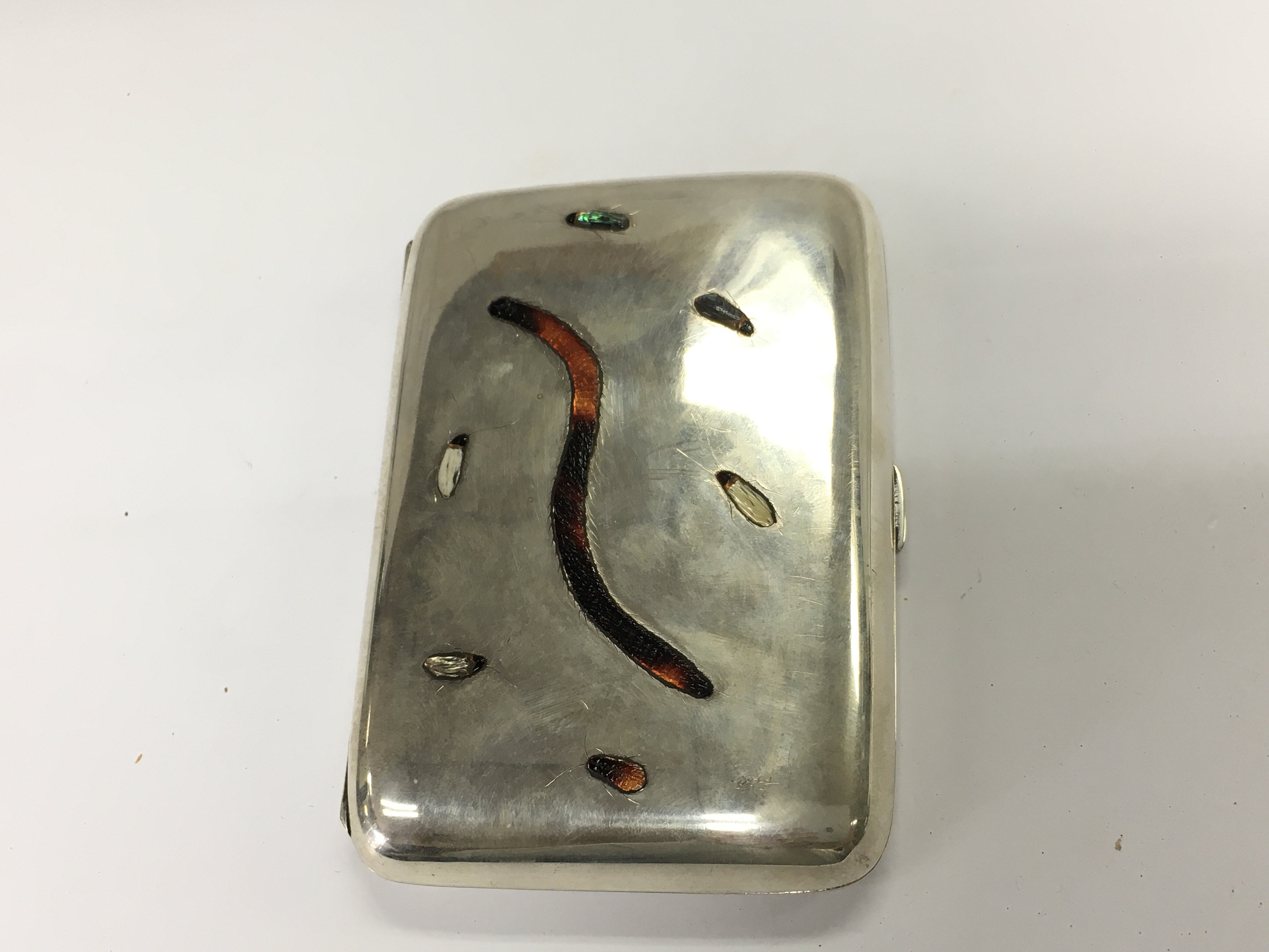 A silver Shibayama cigar case.