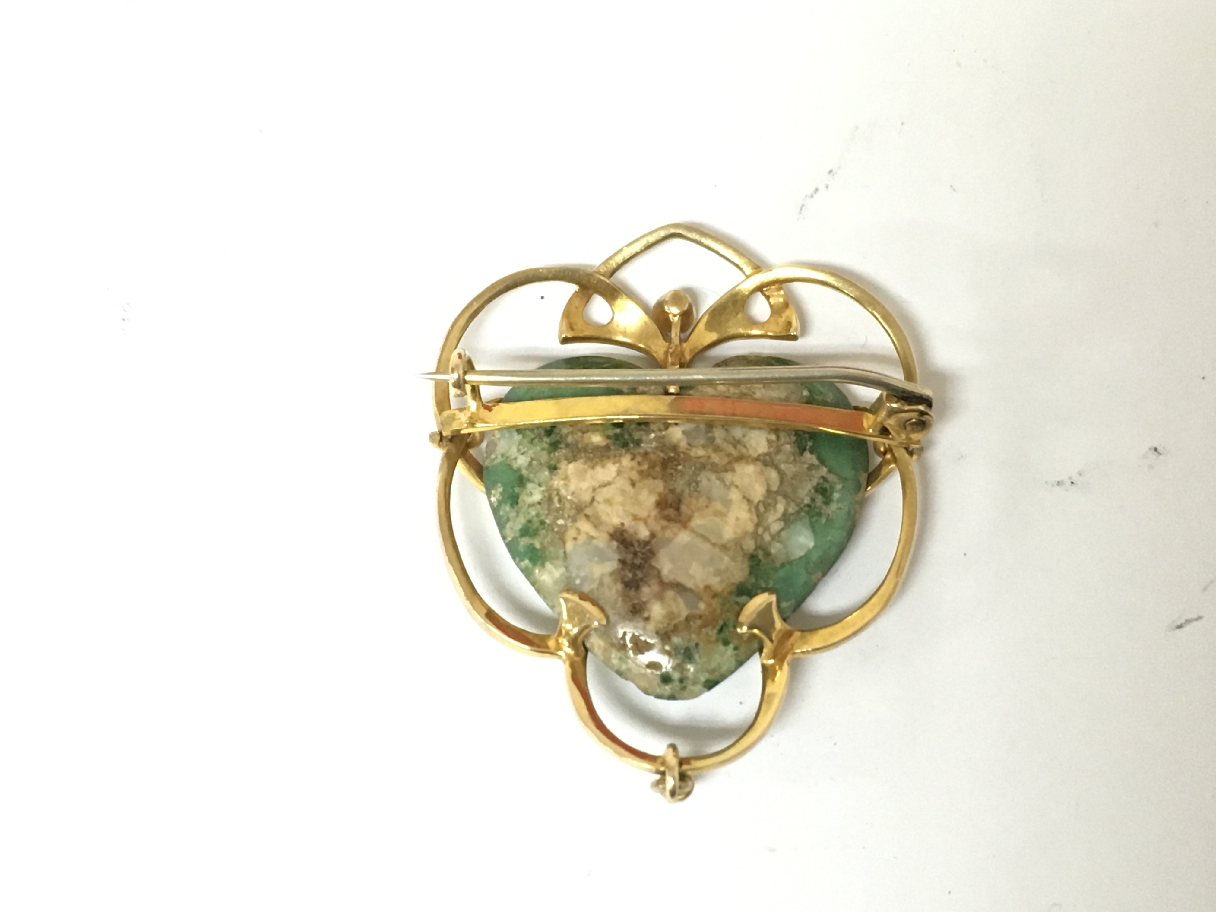 An art nouveau yellow metal and turquoise brooch with a seed Pearl. 7.63g