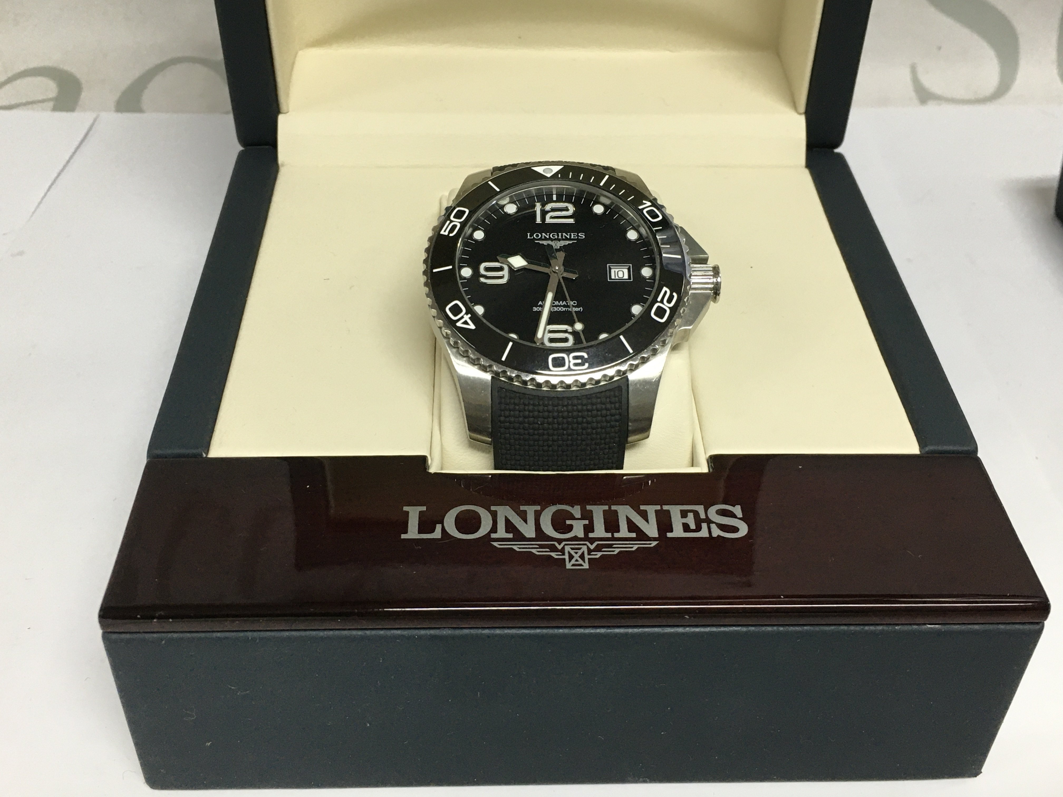 A gents Longines Hydris Conquest automatic watch with box and papers. Shipping category B.