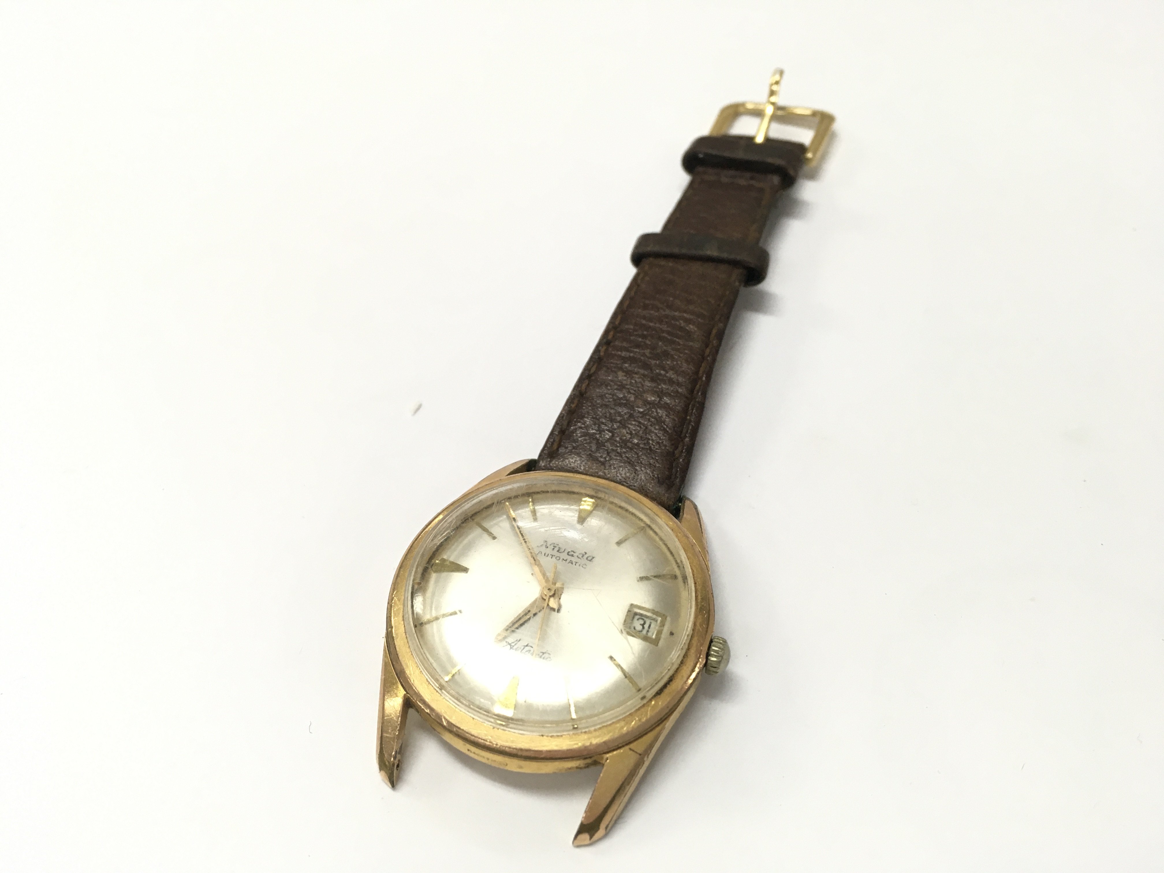 A boxed vintage gents Nivada Swiss automatic watch . Postage category A