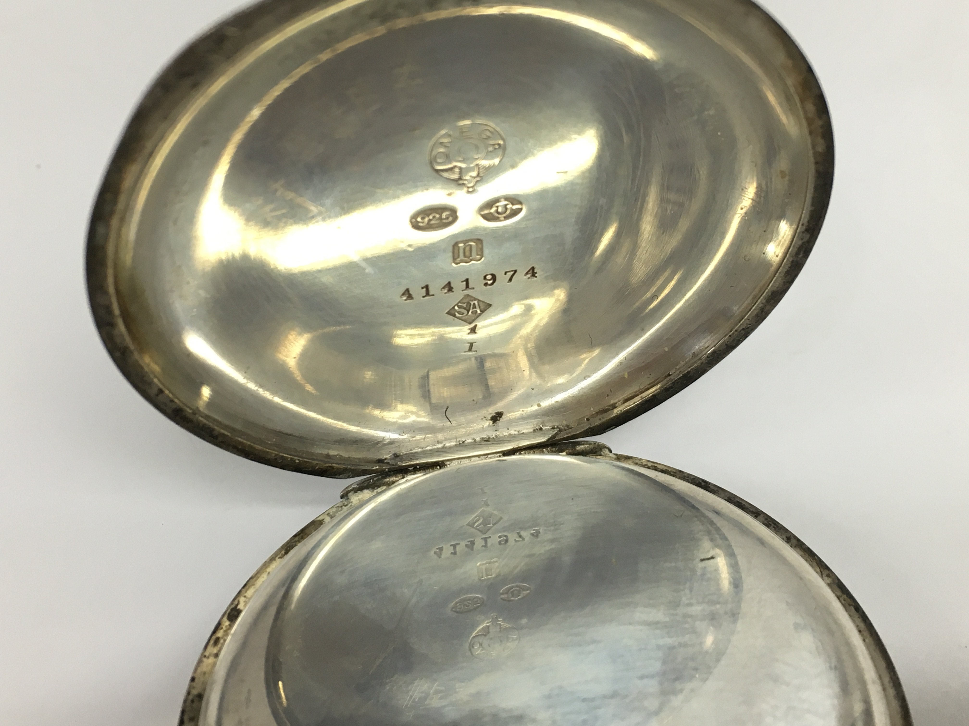 A silver cased button wind pocket watch. Winds and runs. Approximately 50mm case and 105g