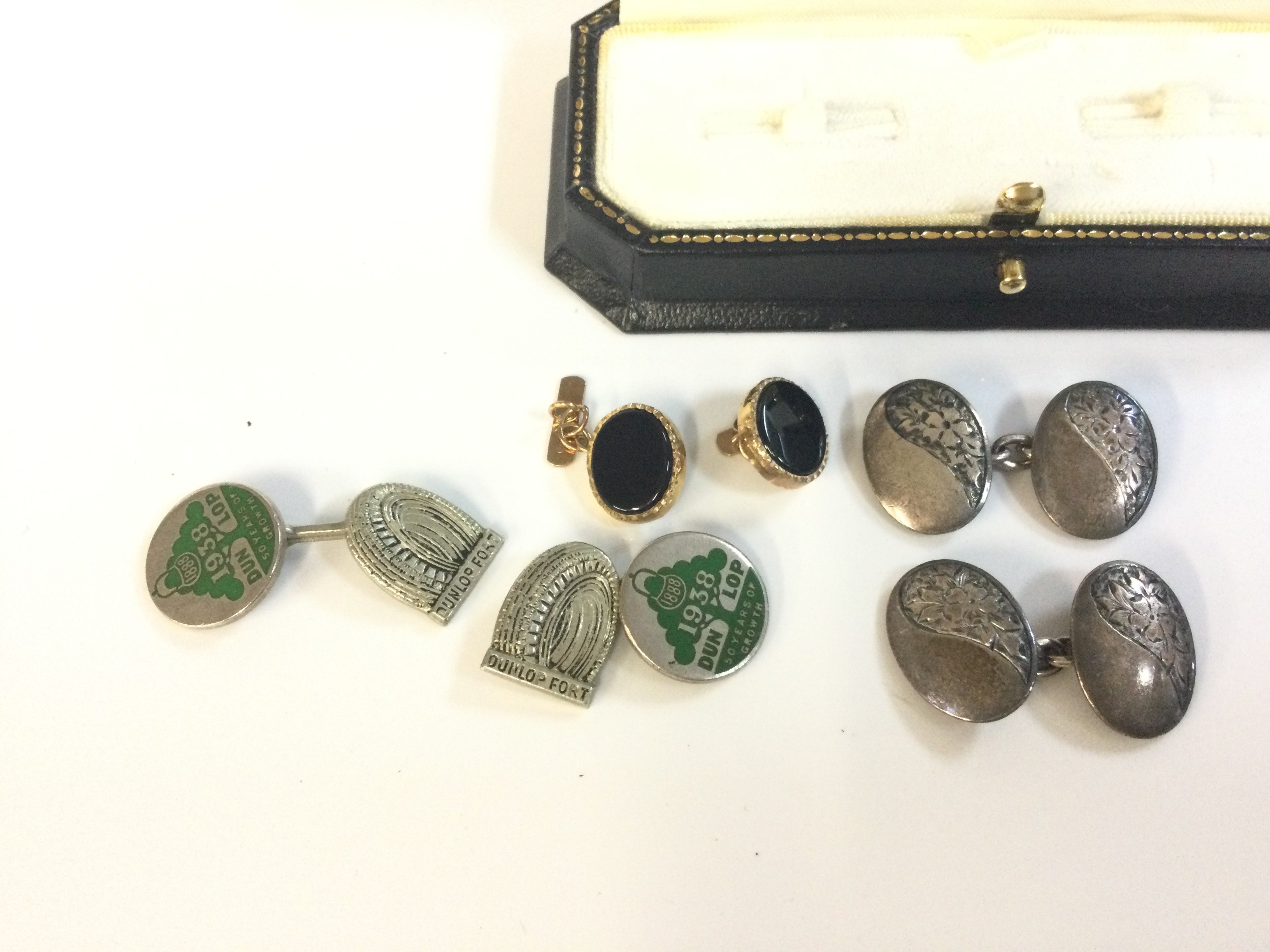 Two pairs of silver cufflinks including a Pair of Dunlop tyres 50 years cuffs and one part 9 carat gold cufflinks , 3.3G total weight. Postage category A