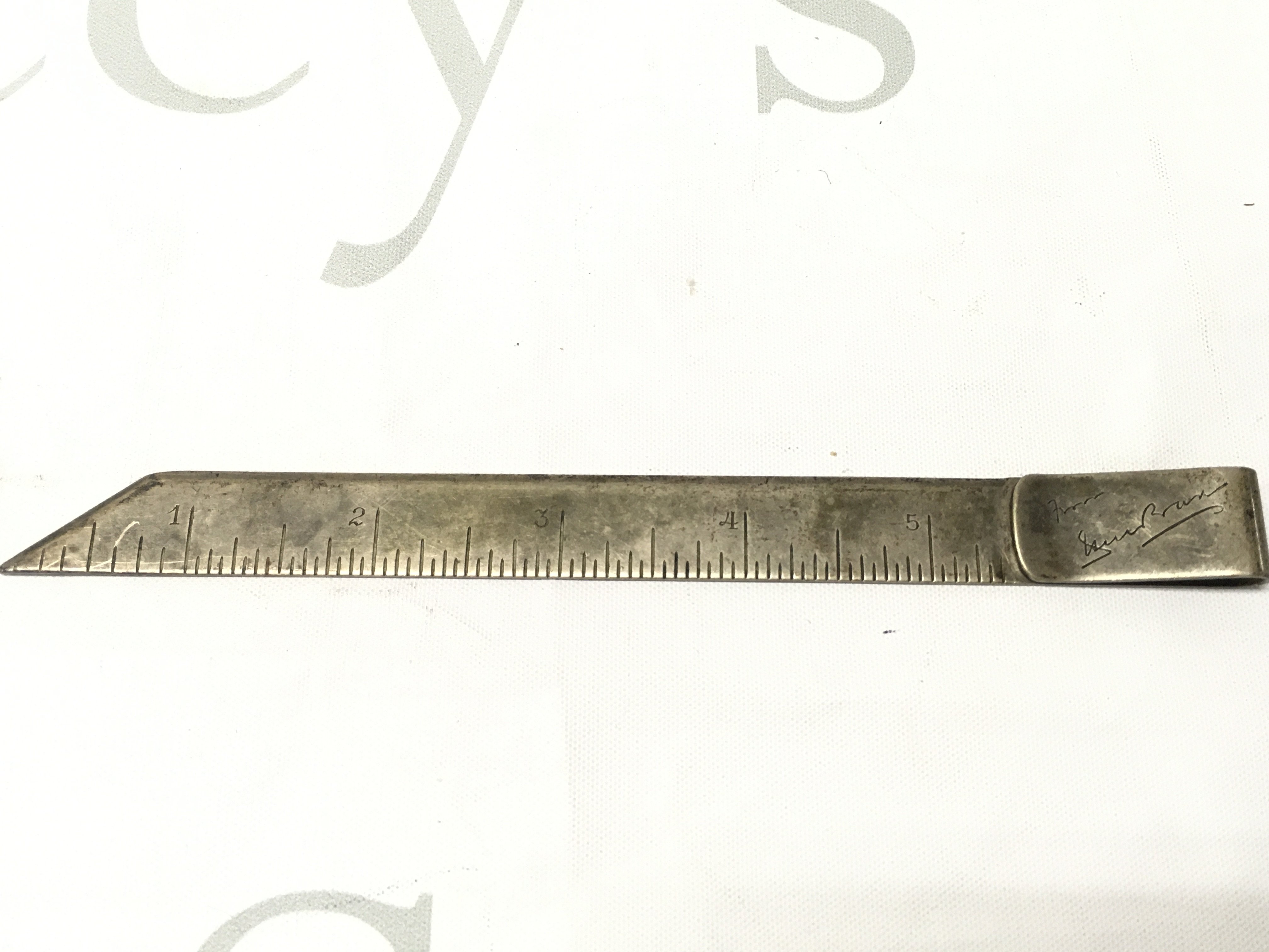 An unusual silver paper knife/book mark.