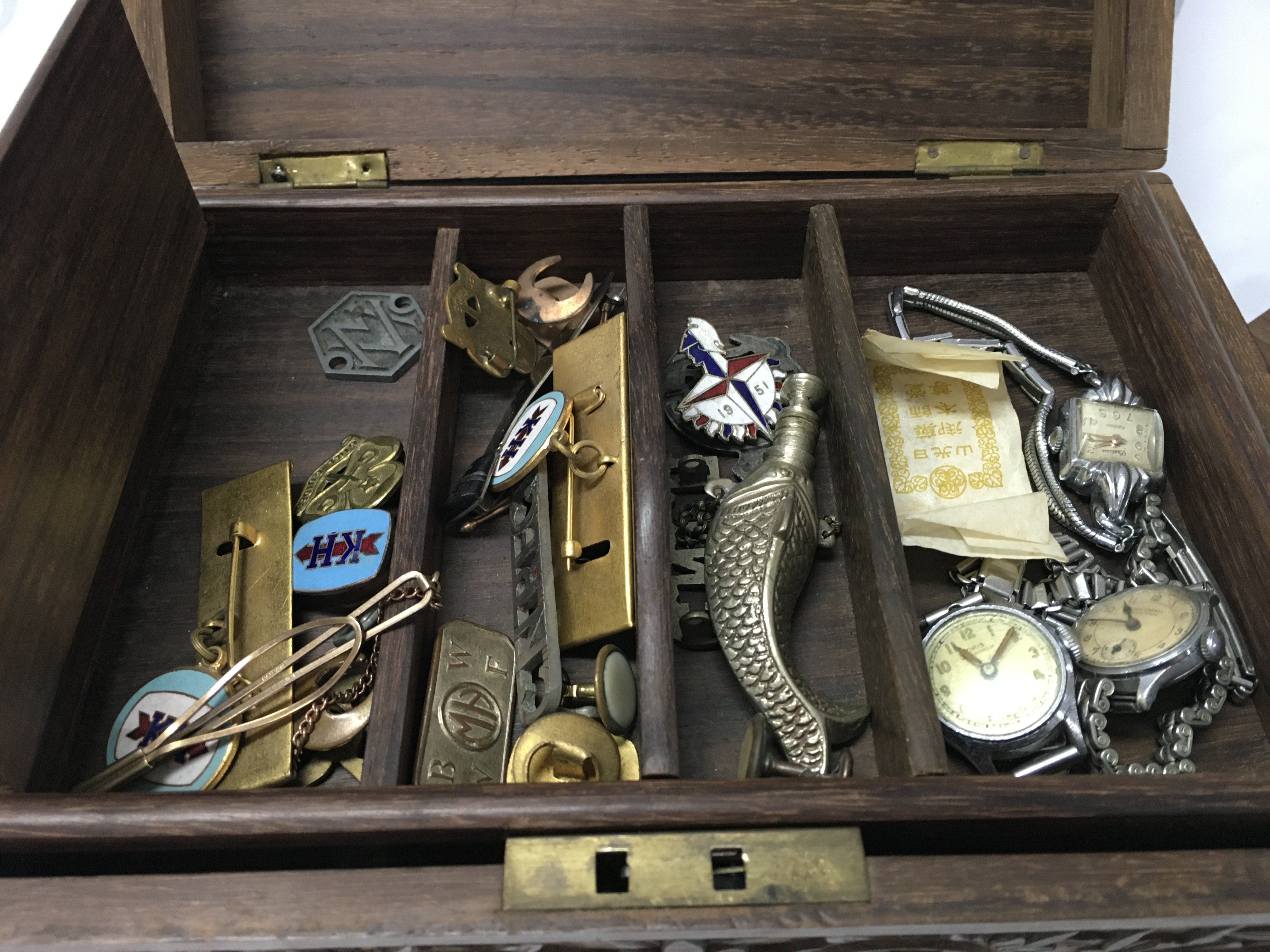 An Indian teak box and with contents including jewellery.