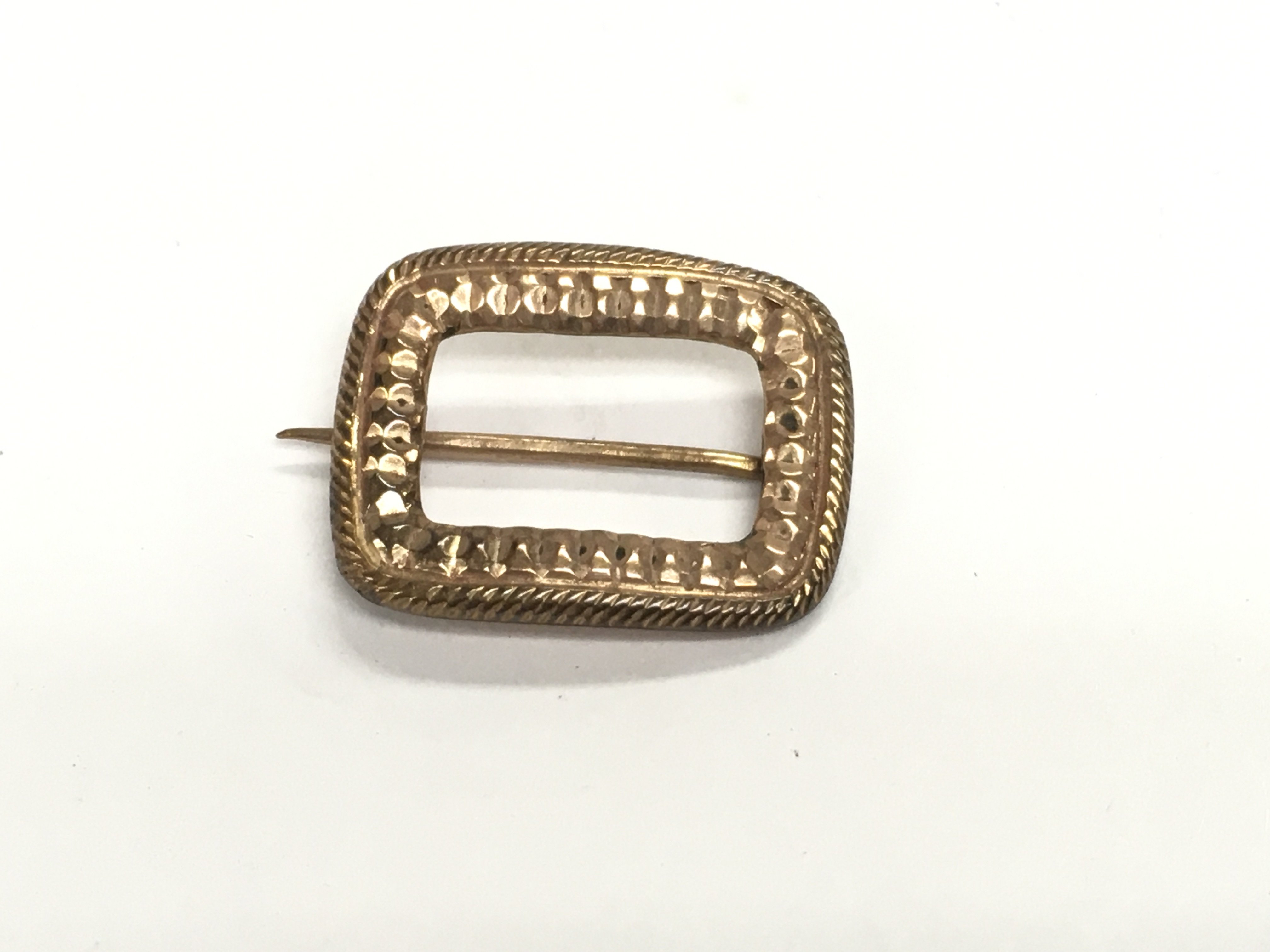 An unmarked gold buckle brooch. 1.61g