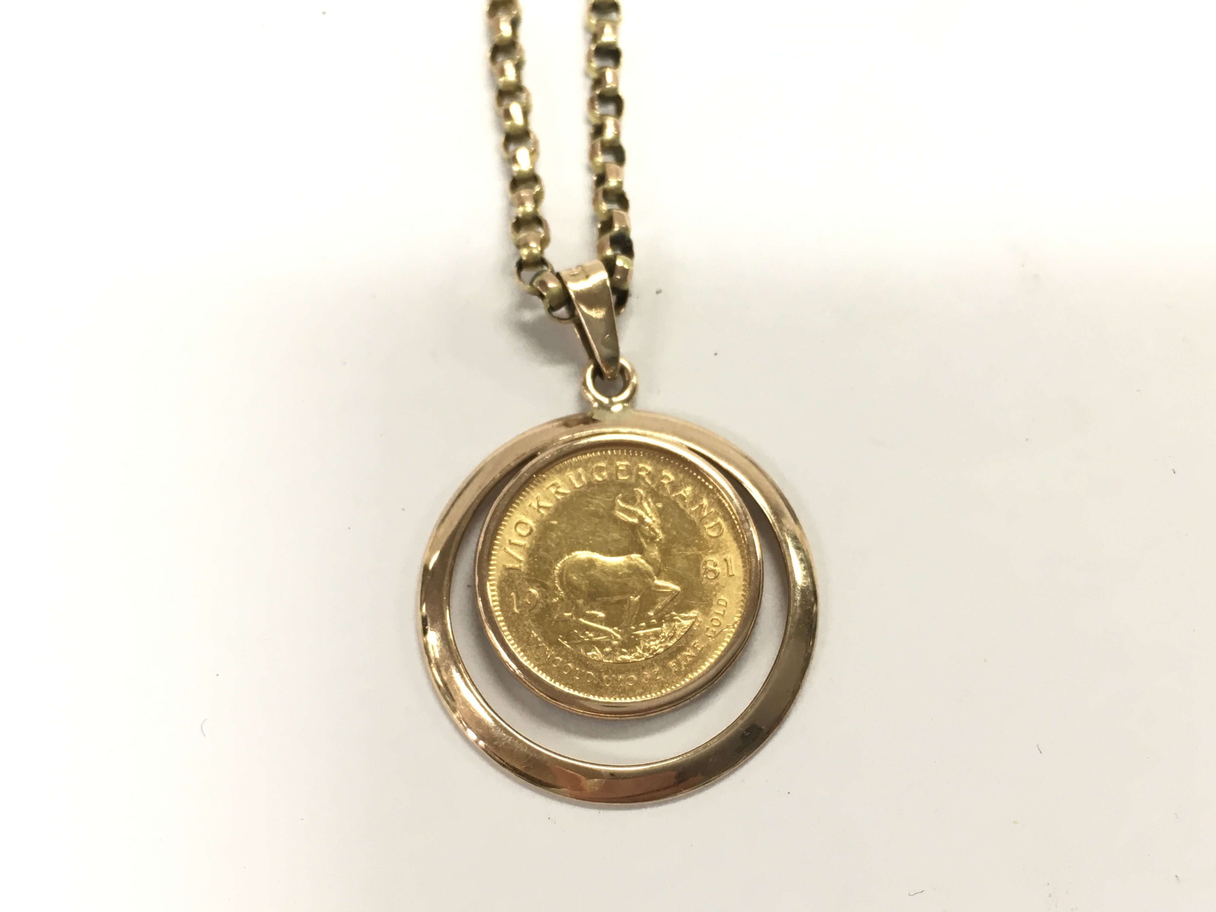 1/10oz Krugerrand on an unmarked 9ct gold chain. 9.92g