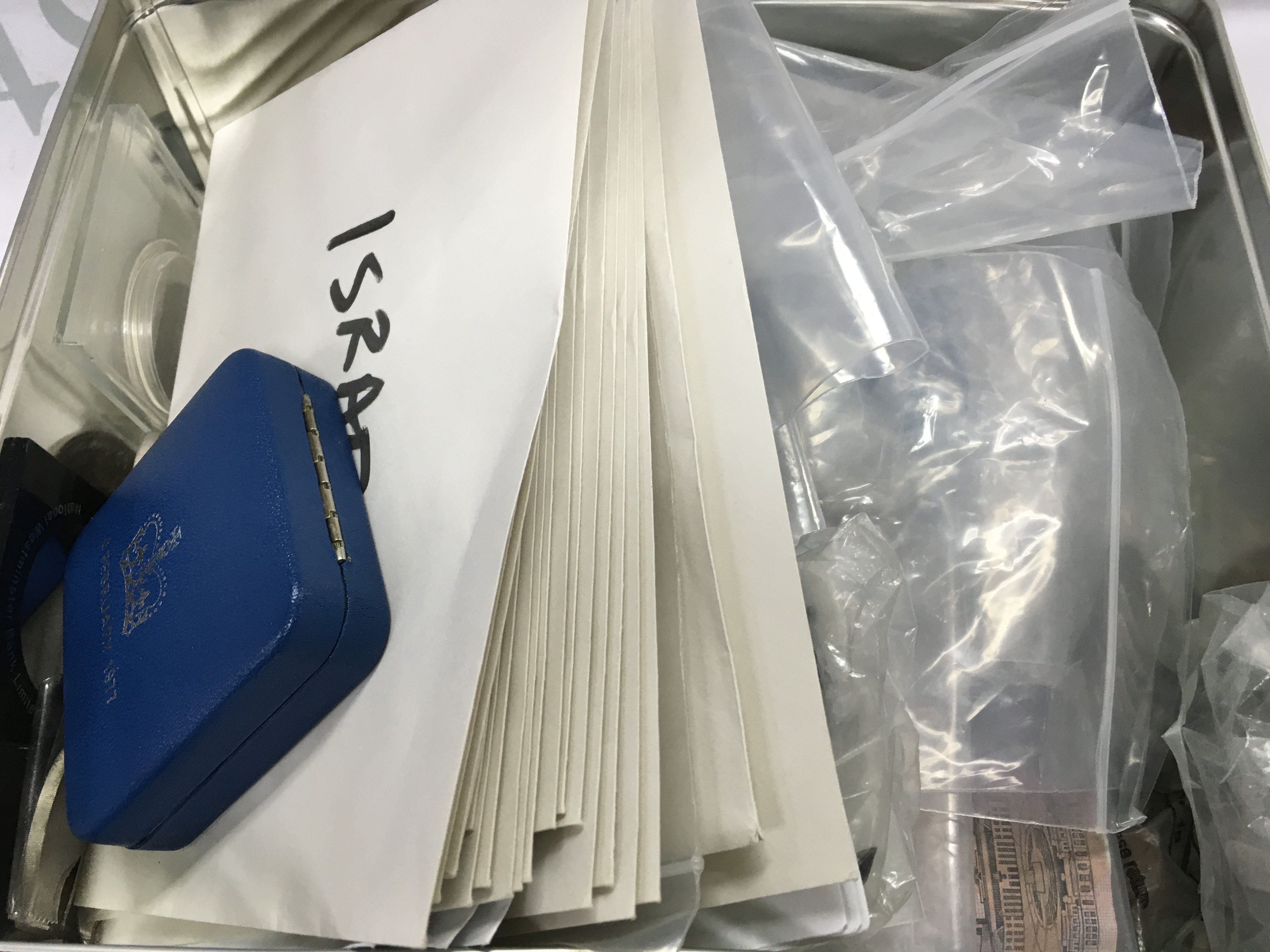 A 1977 silver crown, and other used circulated world coinage and bank notes . Postage category B