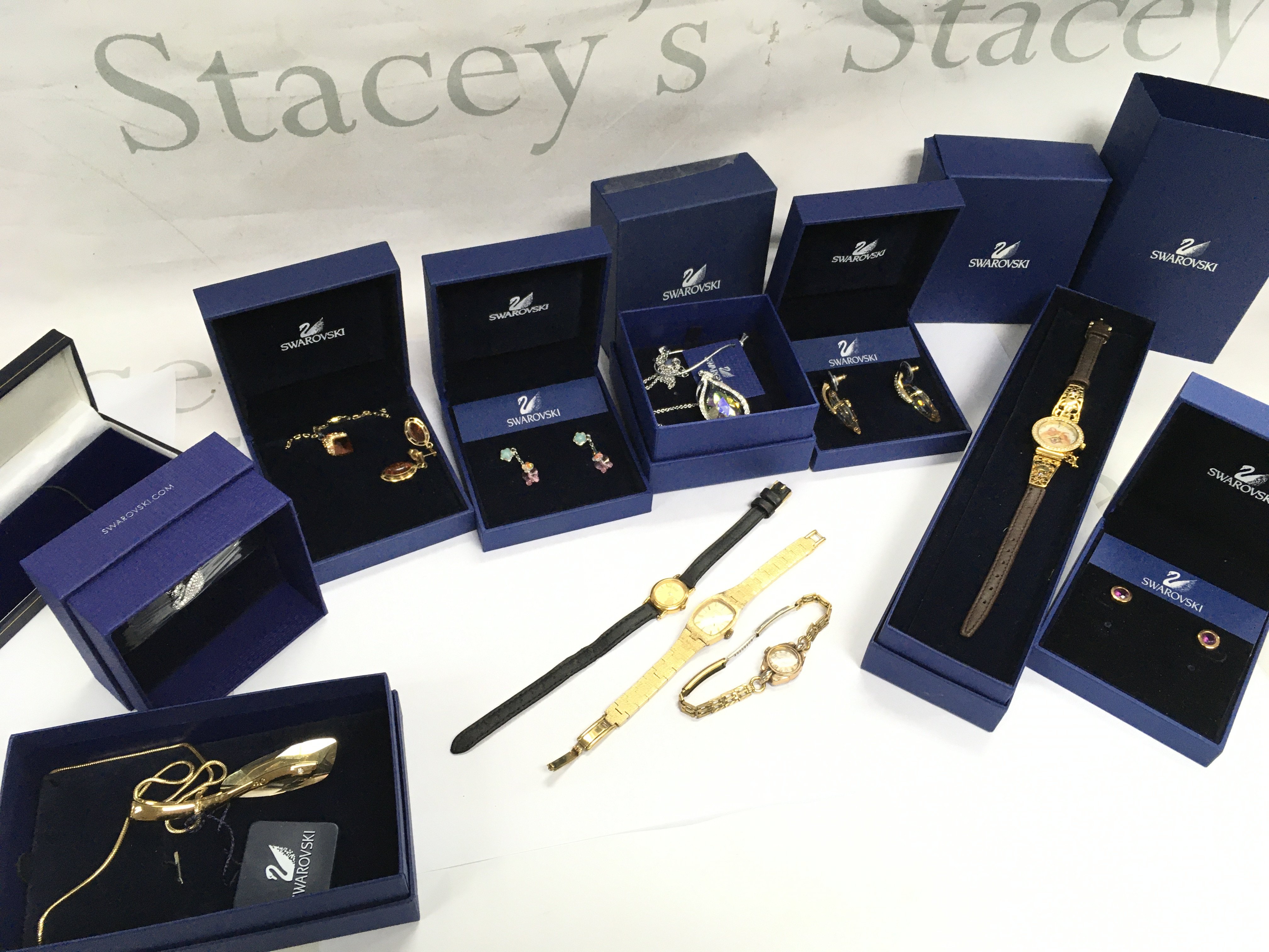 Boxed Swarovski jewellery including a crystal necklace , floral earrings, Topaz necklace, Pomeranian watch. Also including some ladies watches Montine, Lusina, Seiko. Postage category b