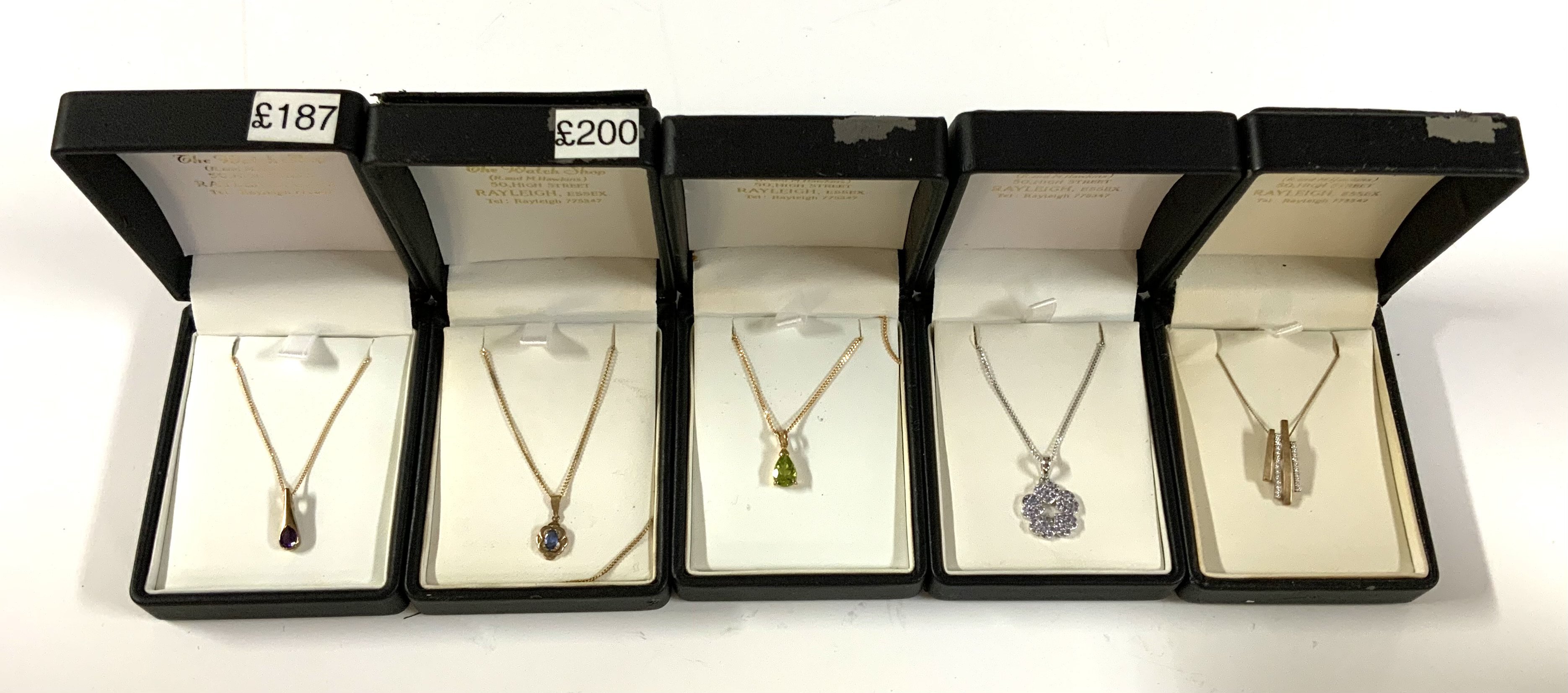 5 9ct gold stone set pendants and chains. (A)