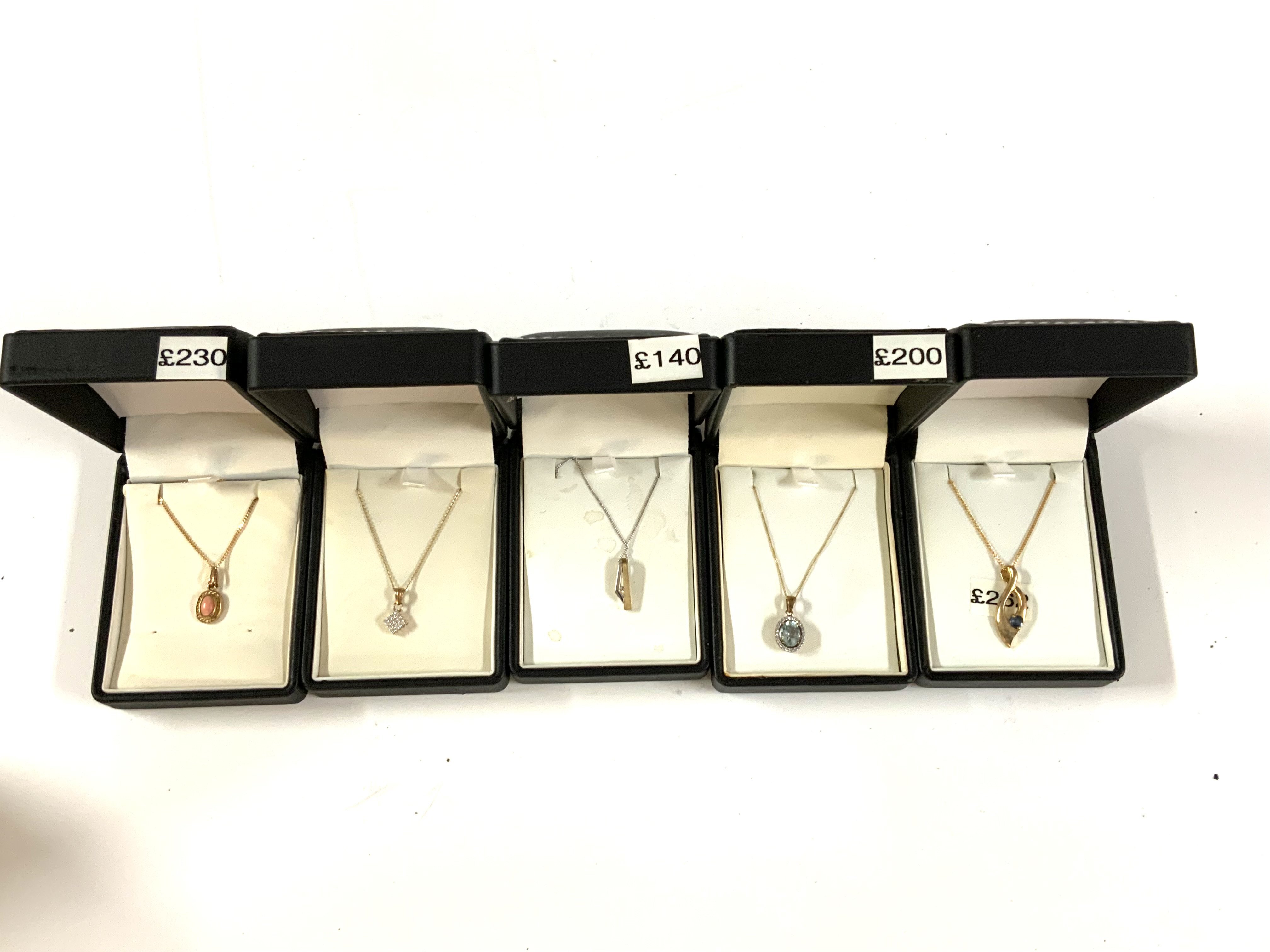 5 9ct gold stone set pendants and chains. (A)